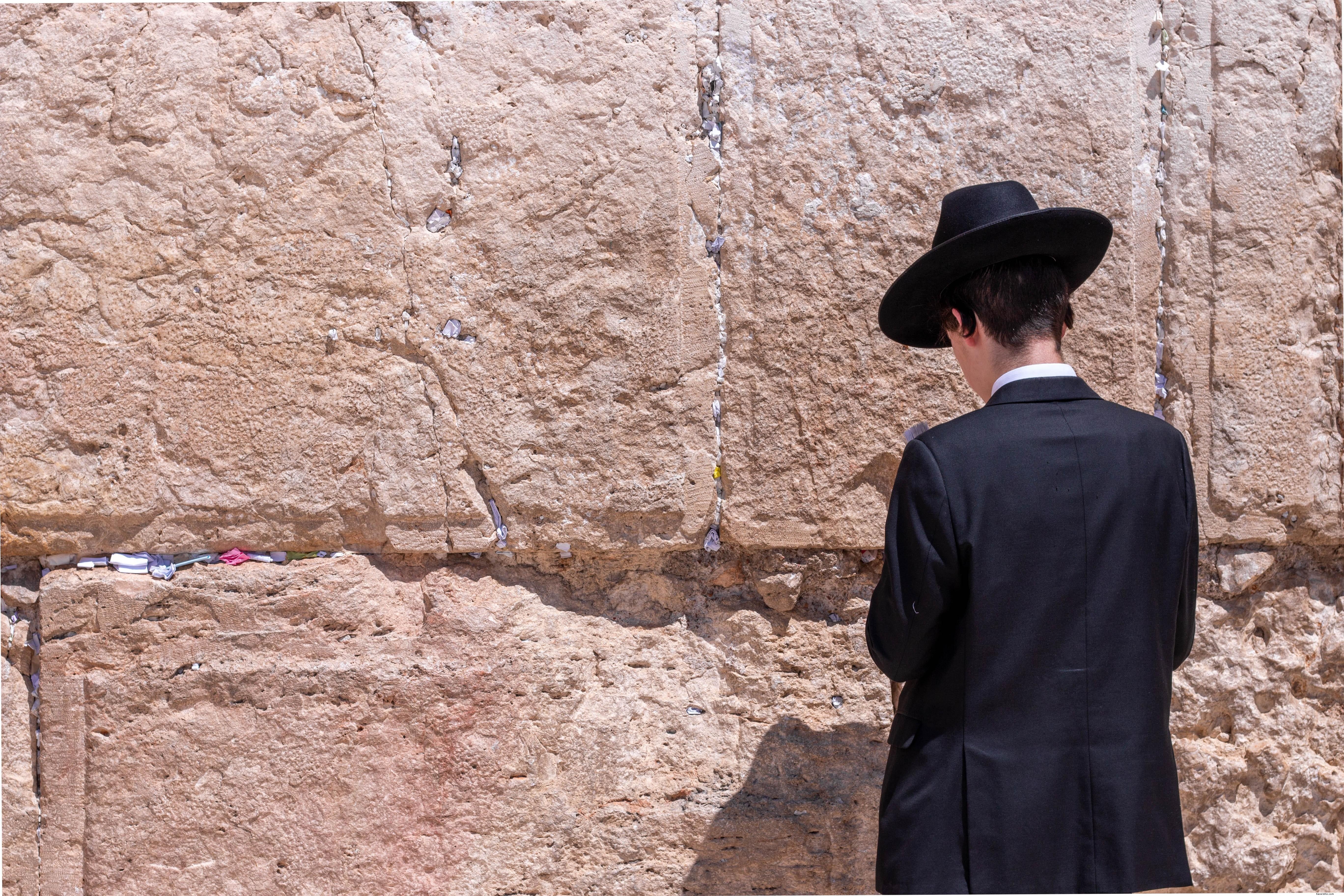 Captivating Photo: Man in Black at Jerusalem s Wailing Wall