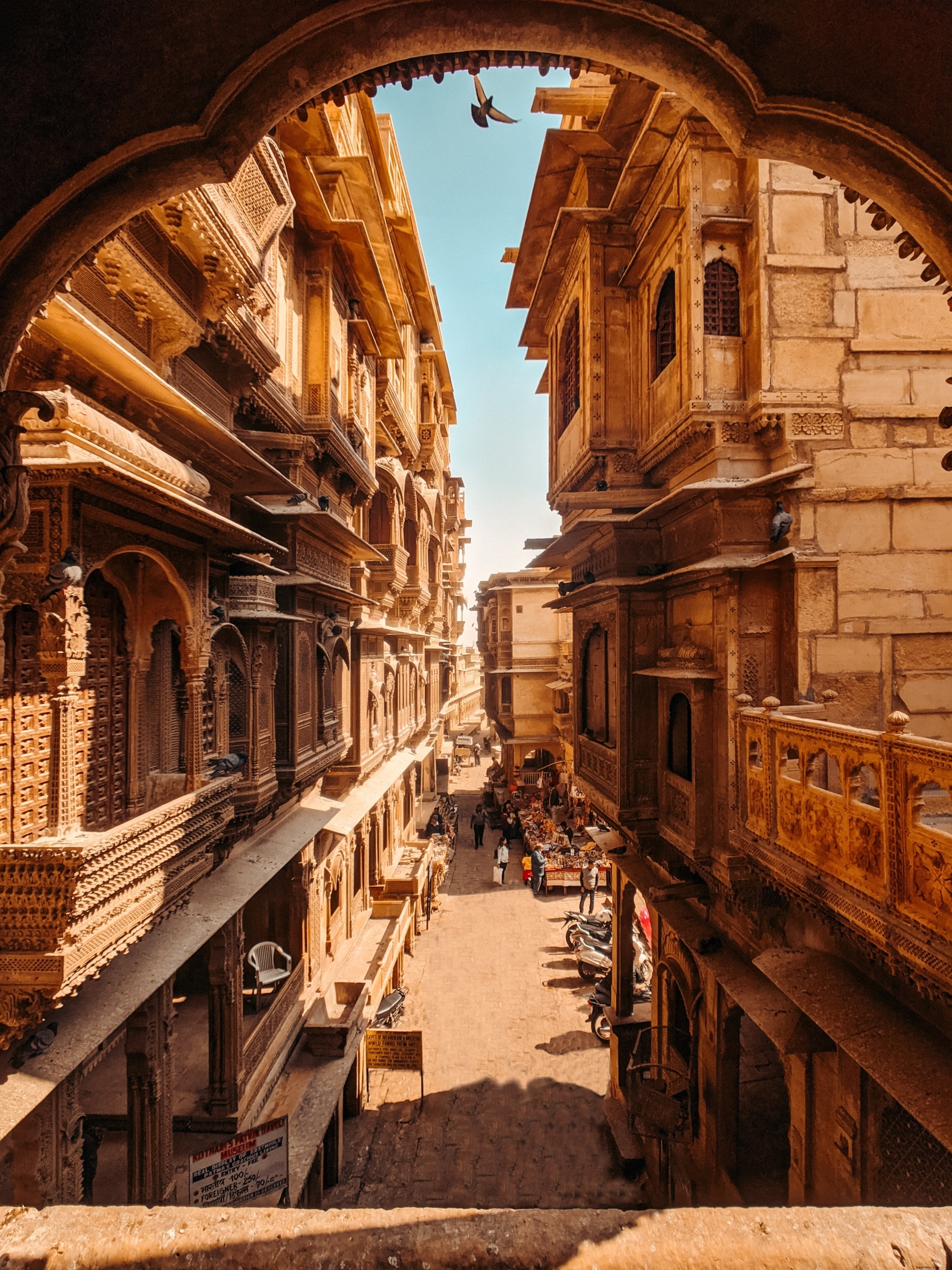 Stunning City Street Photo: Historic Stone Buildings with Intricate Carved Balconies