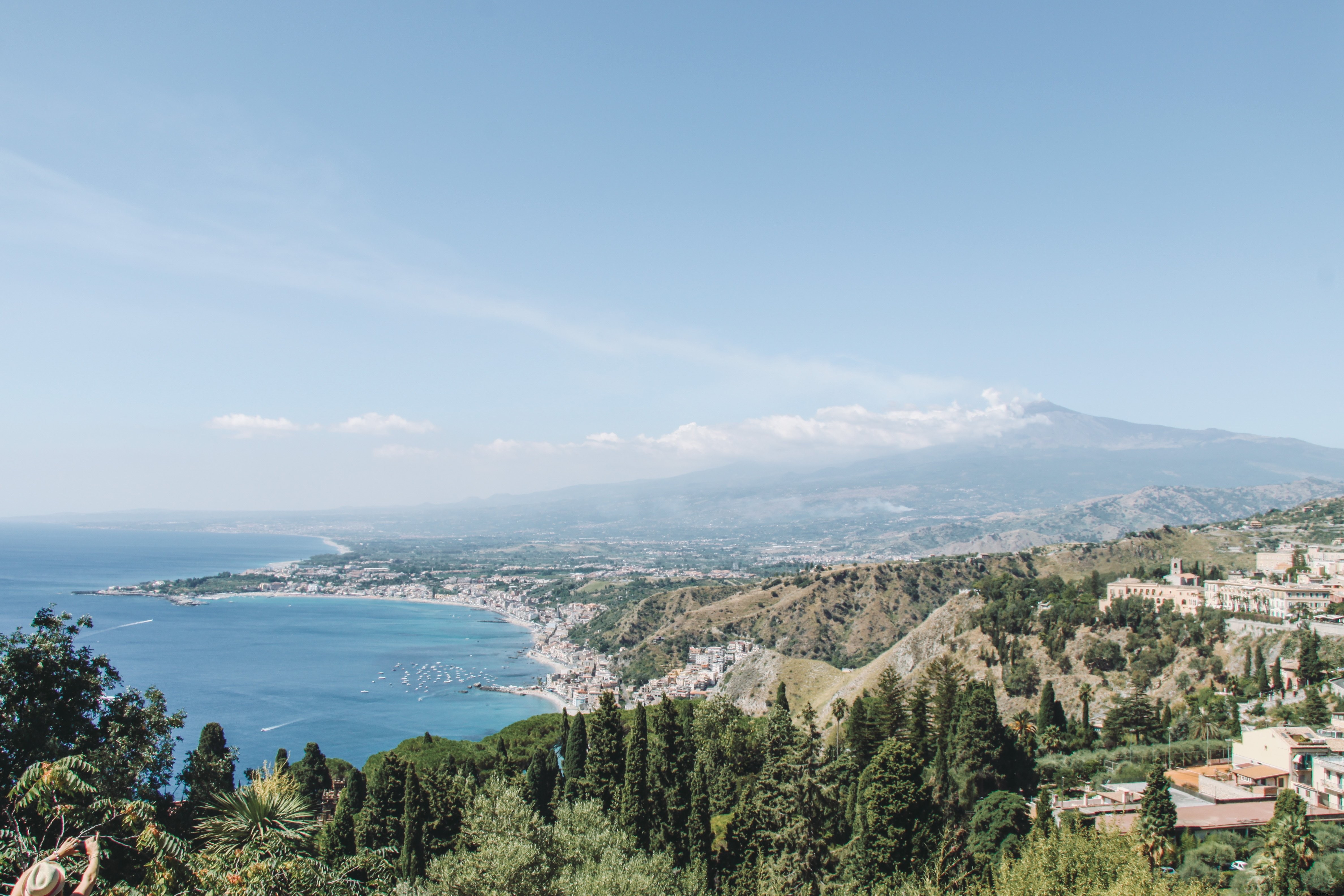 Stunning Sunny Coastline Beneath Distant Mountains – Breathtaking Landscape Photo