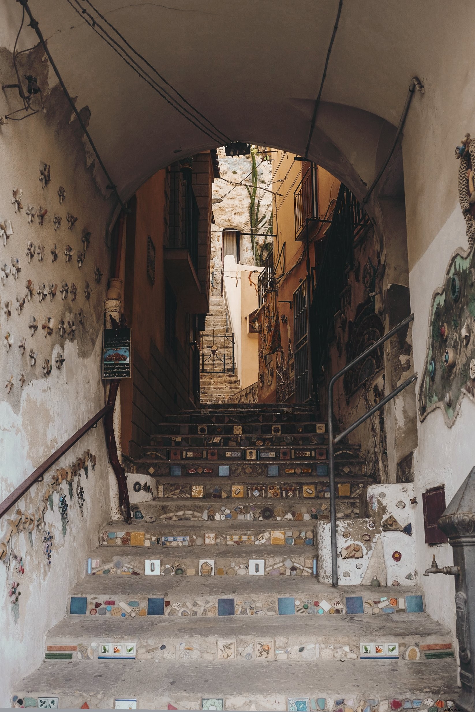 Captivating Photo: Staircase in Arched Tunnel with Intricate Mosaic Details