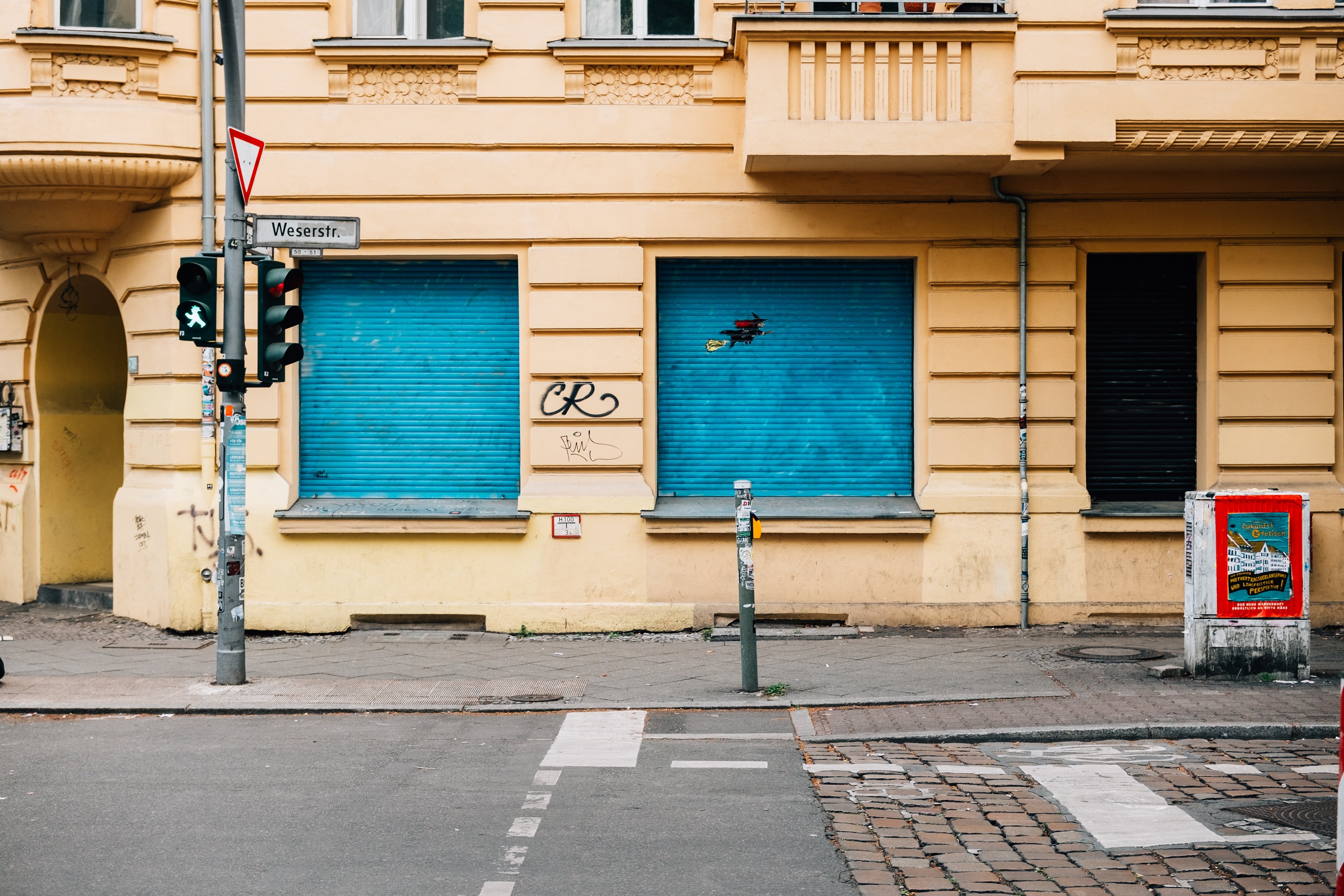 Stunning Photo: Vibrant Yellow City Building with Striking Blue Blinds