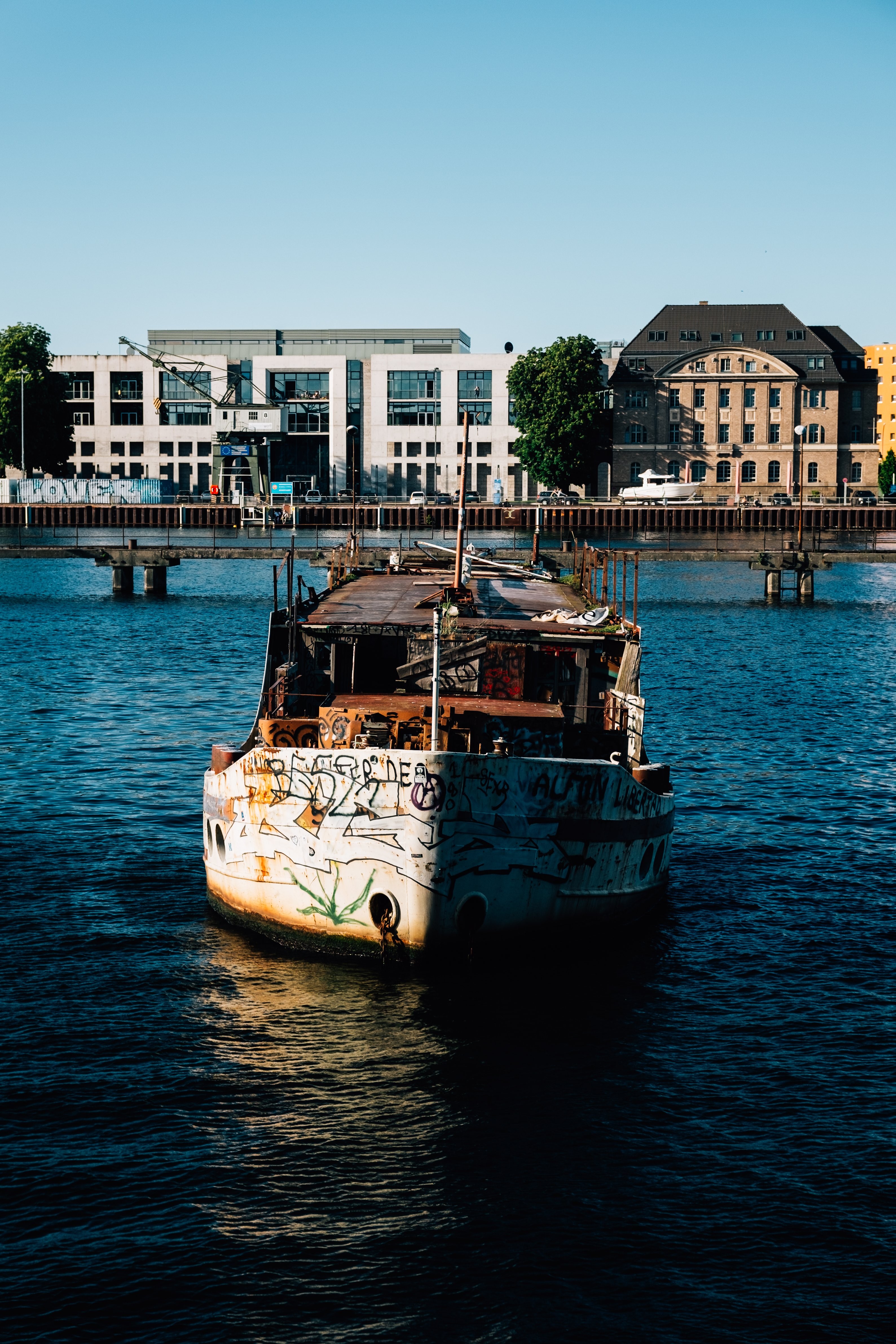 Stunning Vintage Rustic Boat Sailing on Serene Blue Waters – Captivating Photo