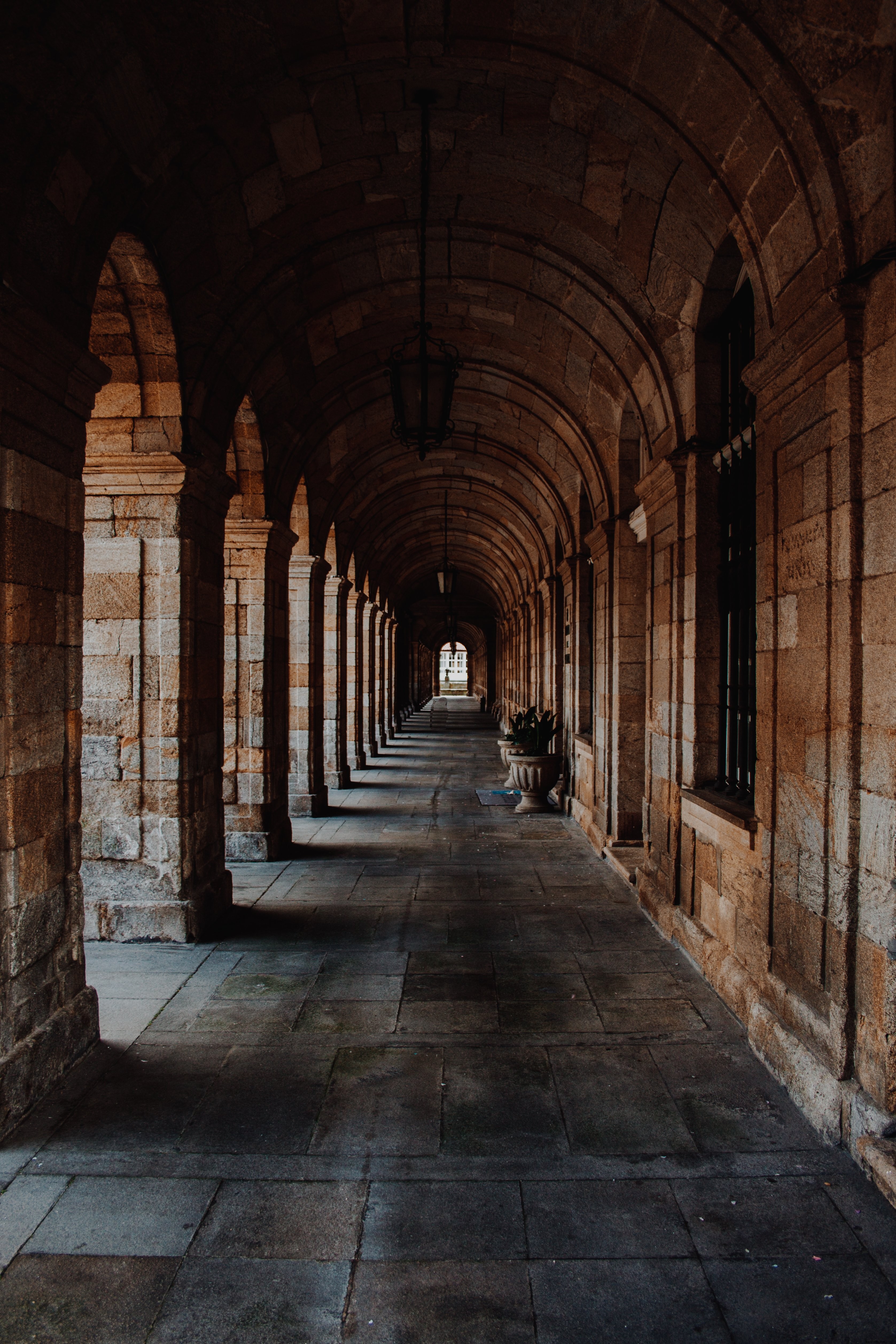 Stunning Stone Arched Hallway Leading to Courtyard – Professional Photo