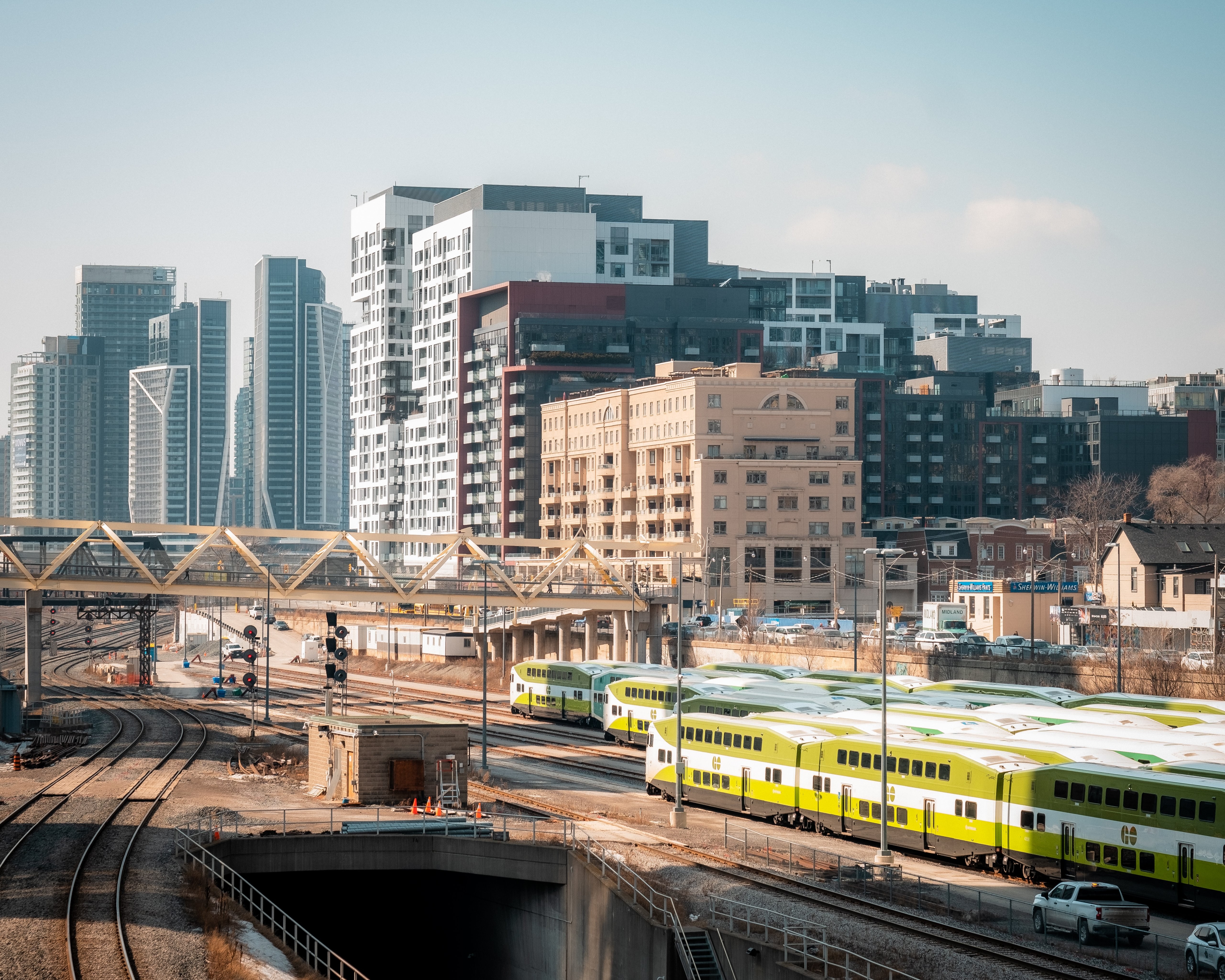Stunning Photo: Majestic White Bridge Spanning a Bustling Train Station