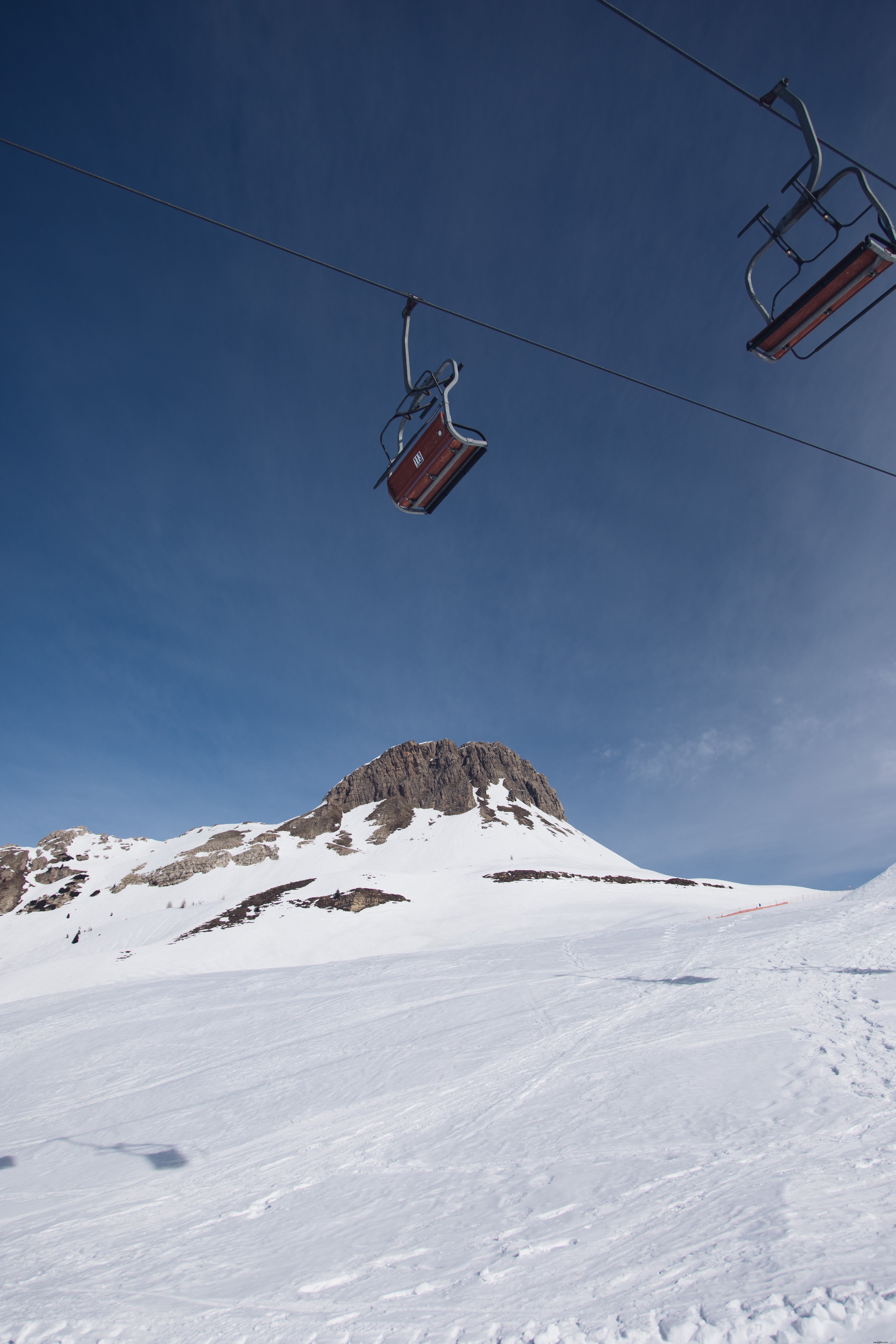 Stunning Photo of Empty Chairlifts Suspended on a Cable