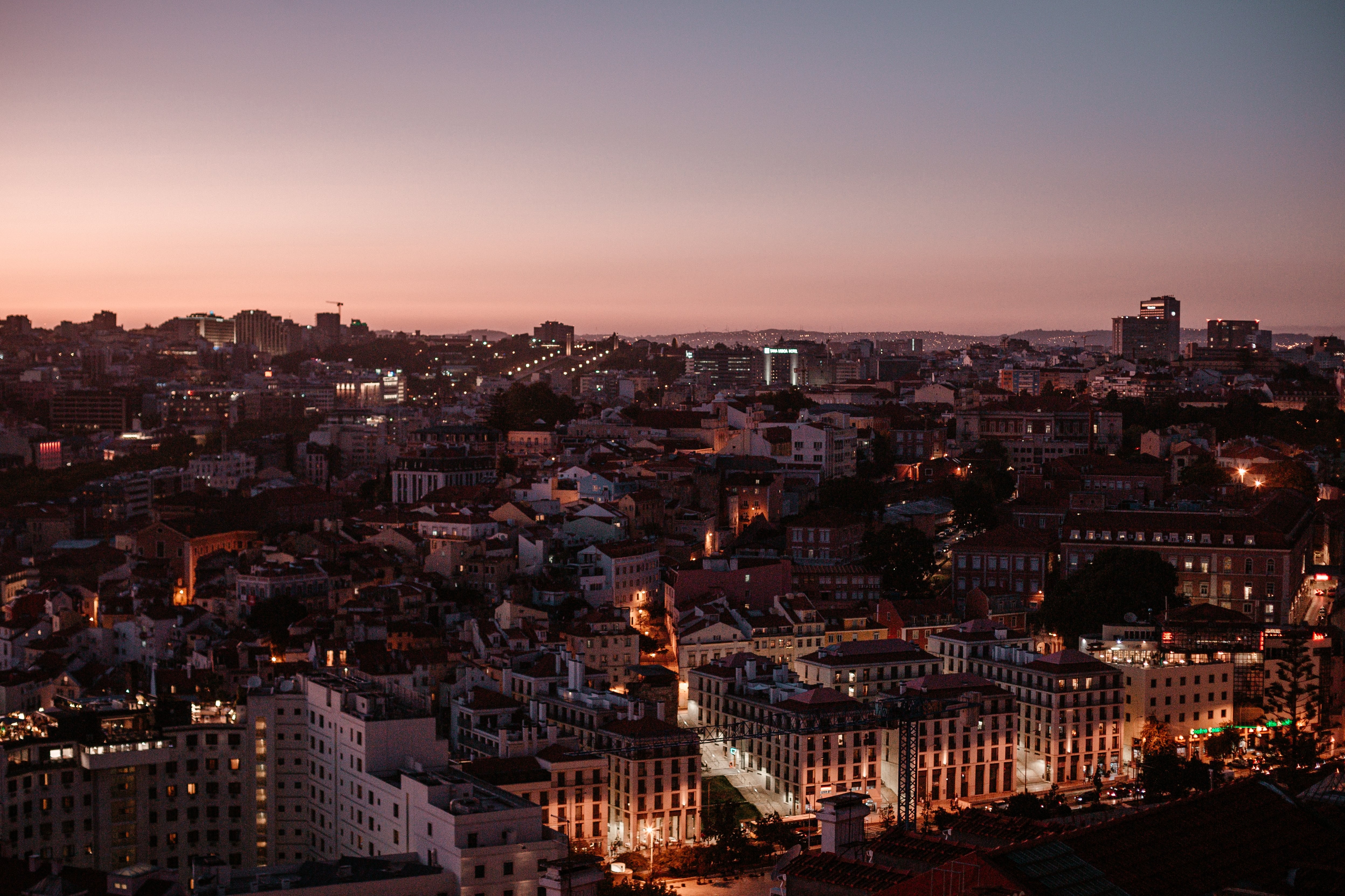 Stunning Aerial View of City Skyline at Vibrant Pink Sunset
