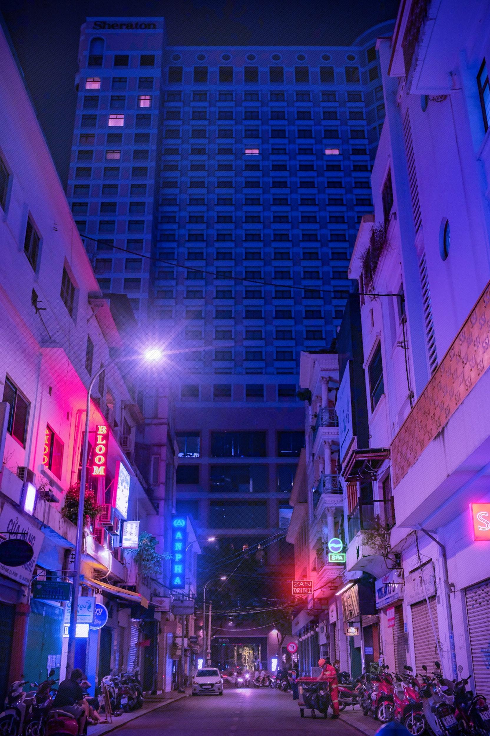 Stunning Photo: Busy City Street Glowing in Blue and Pink Neon Lights