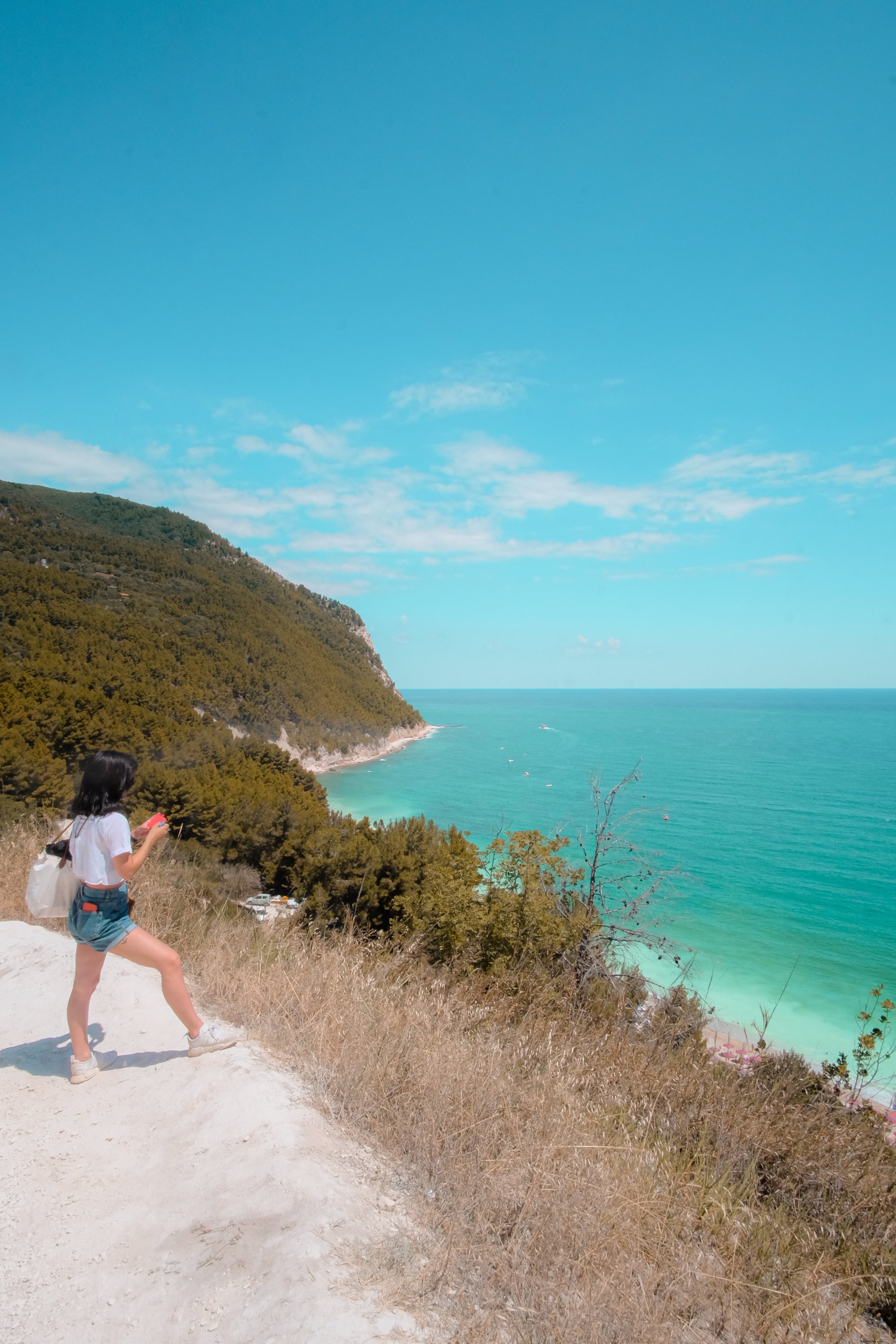 Stunning Photo: Person on Pristine White Sandy Hill Overlooking the Ocean