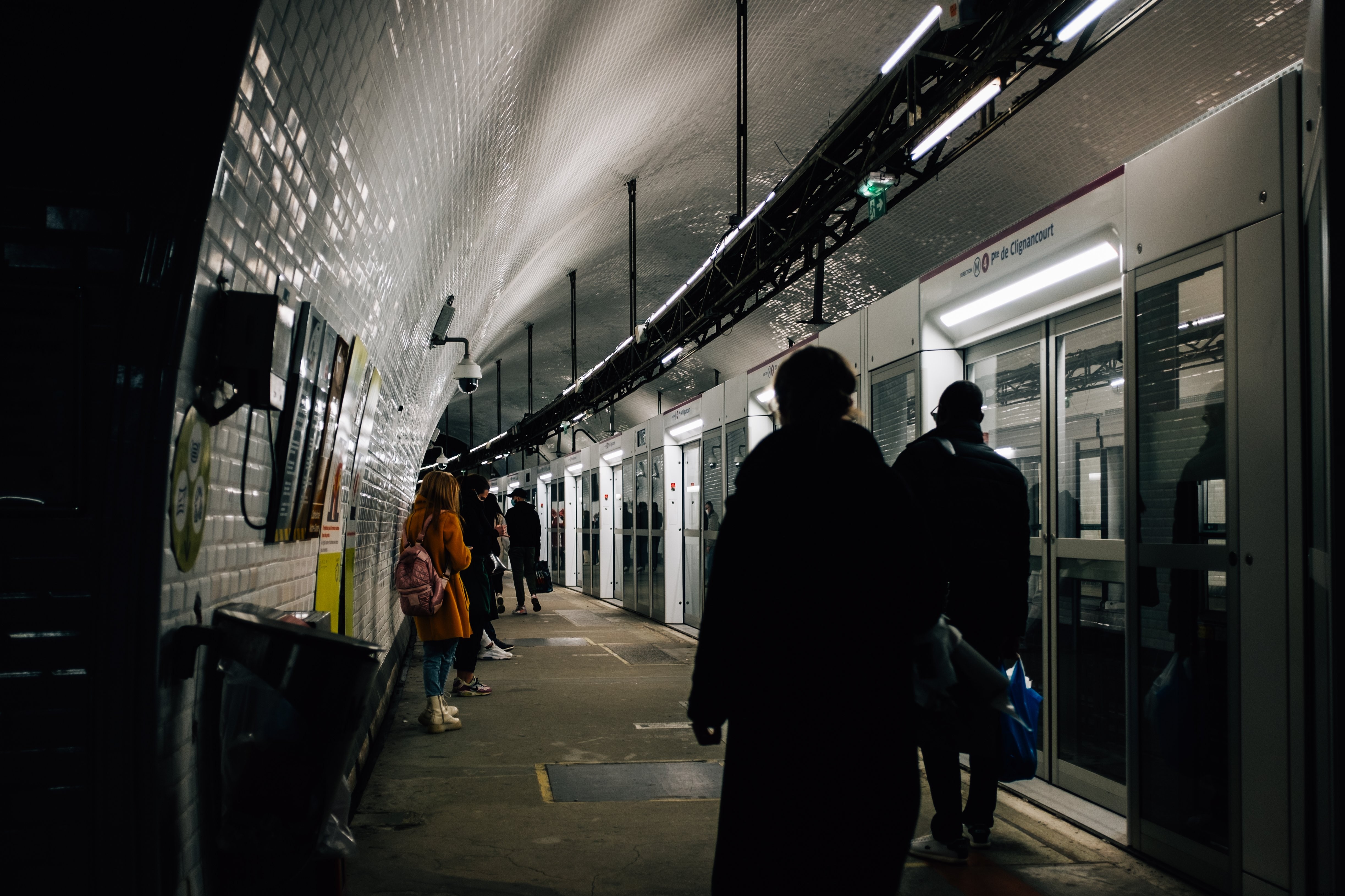 Captivating Photo: Commuters Waiting to Board Underground Train
