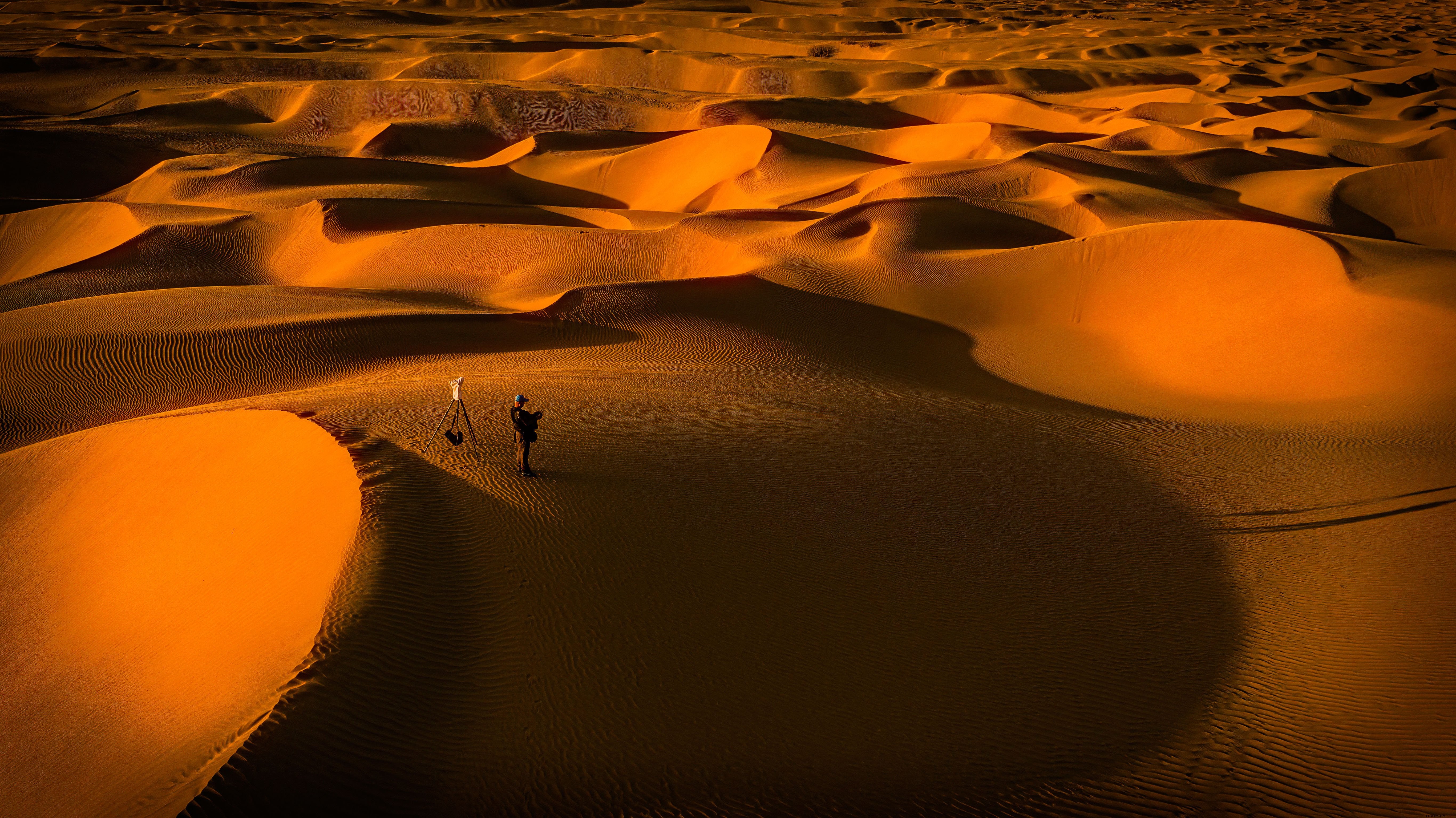 Stunning Sand Dunes Landscape with Photographer Captured in Frame