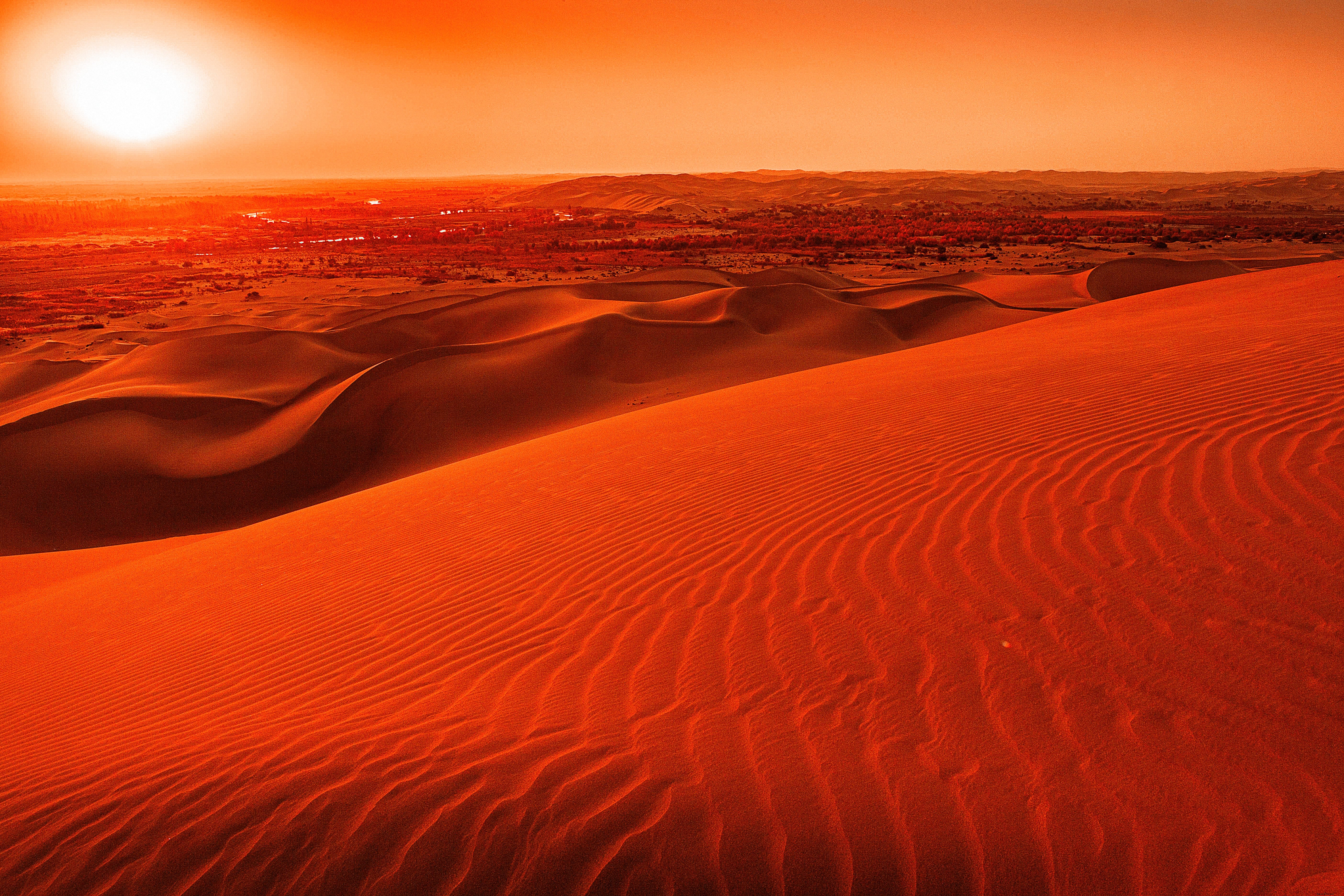 Stunning Orange Sunset Over Wavy Sand Dunes – Breathtaking Landscape Photo