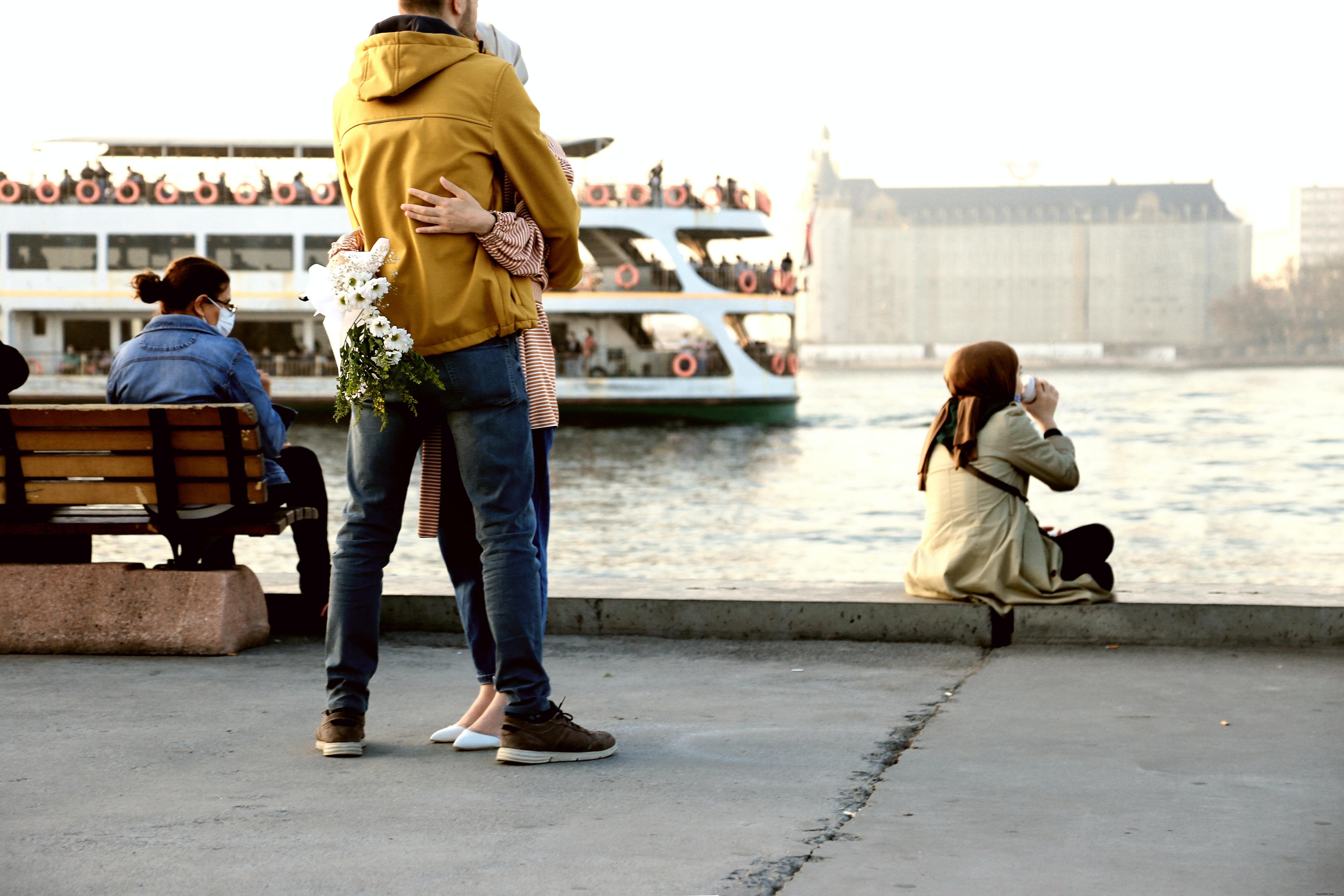 Mask-Wearing Visitors on the Boardwalk by the Open Water – A Scenic Snapshot