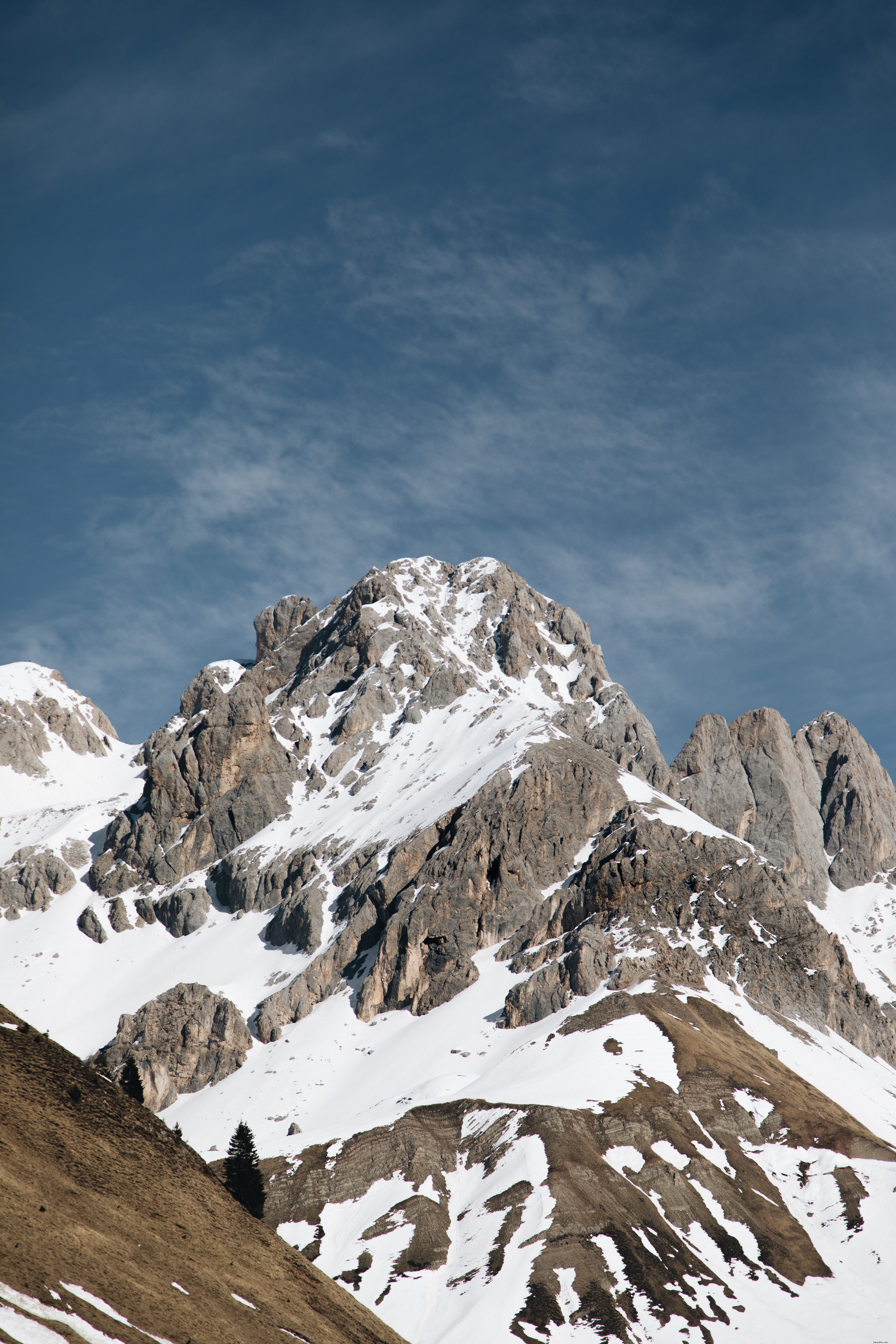 Stunning Mountain Range Beneath a Clear Blue Sky – Captivating Landscape Photo
