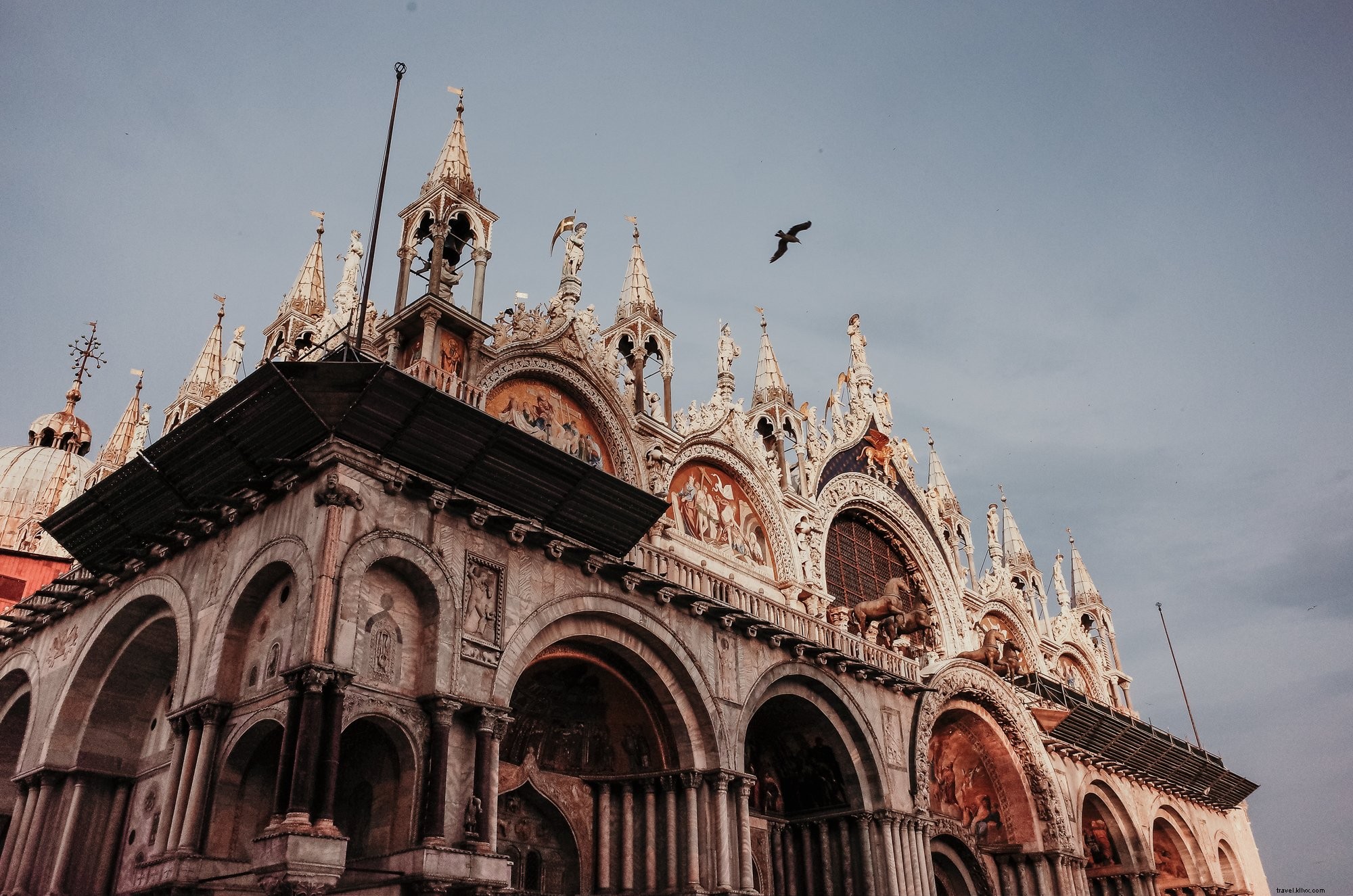 Elegant Carved Architecture with a Bird in Flight