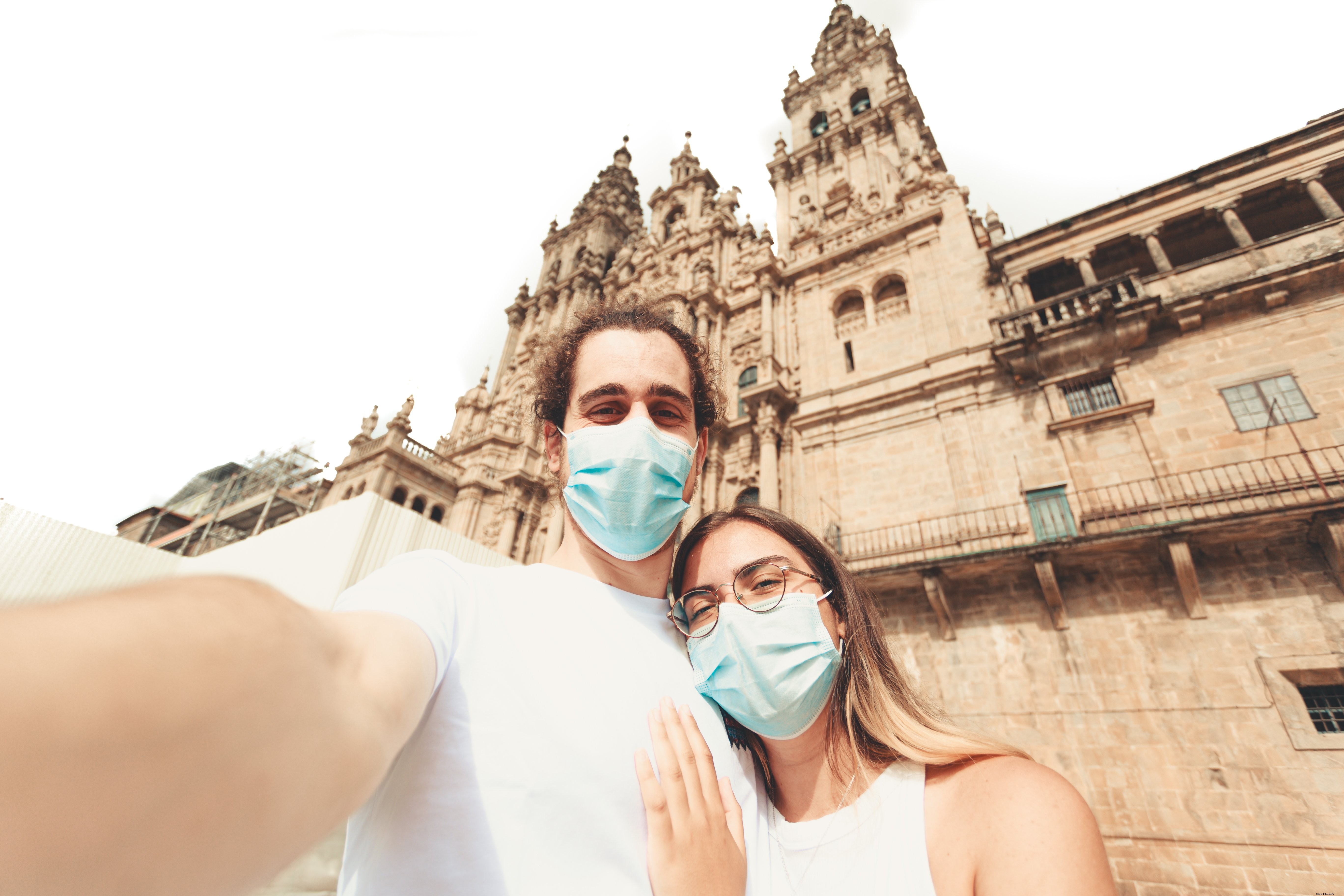 Man and Woman Wear Face Masks in a Polite Photo Capture