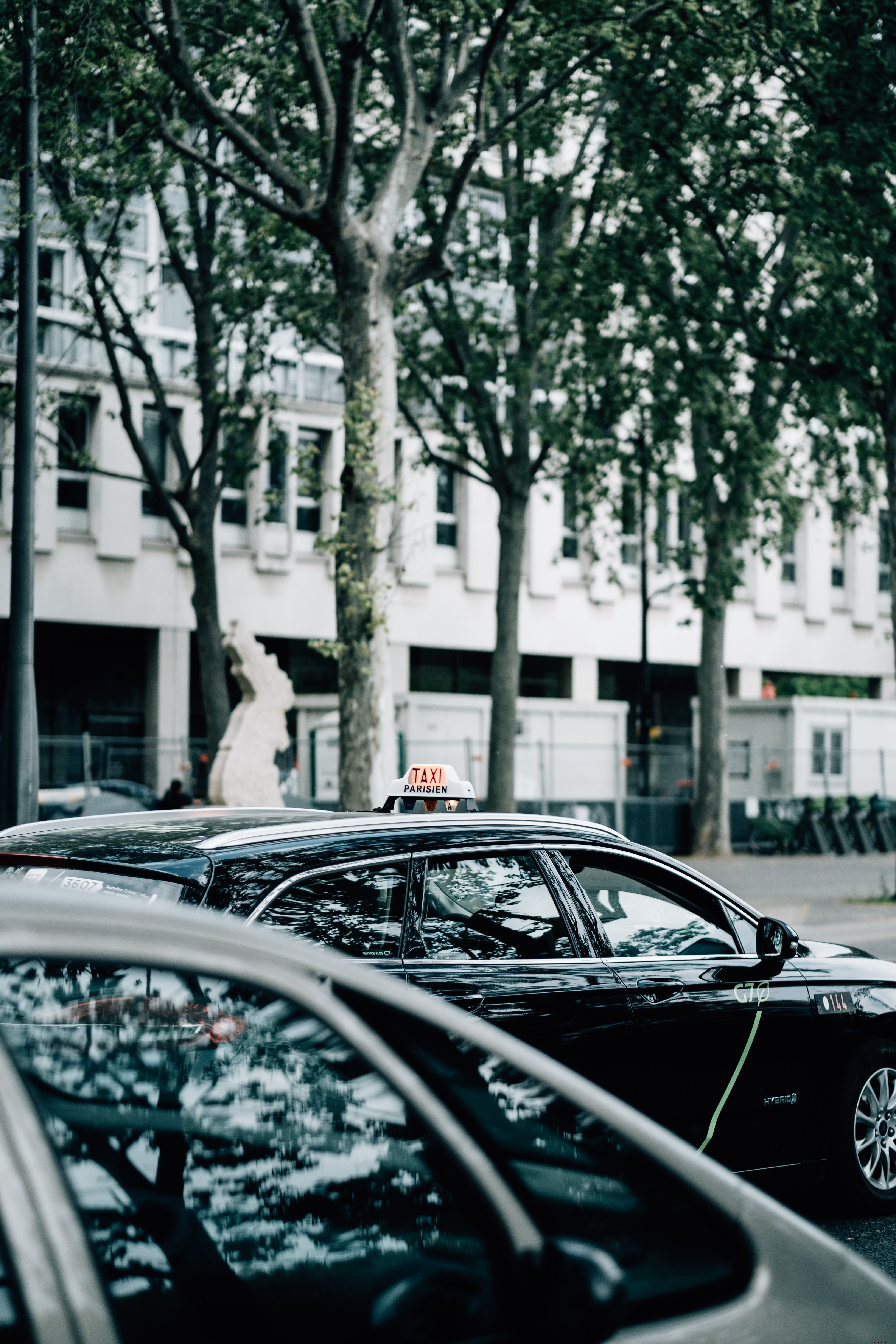 High-Quality Photo of a Black Taxi Car with Roof Sign