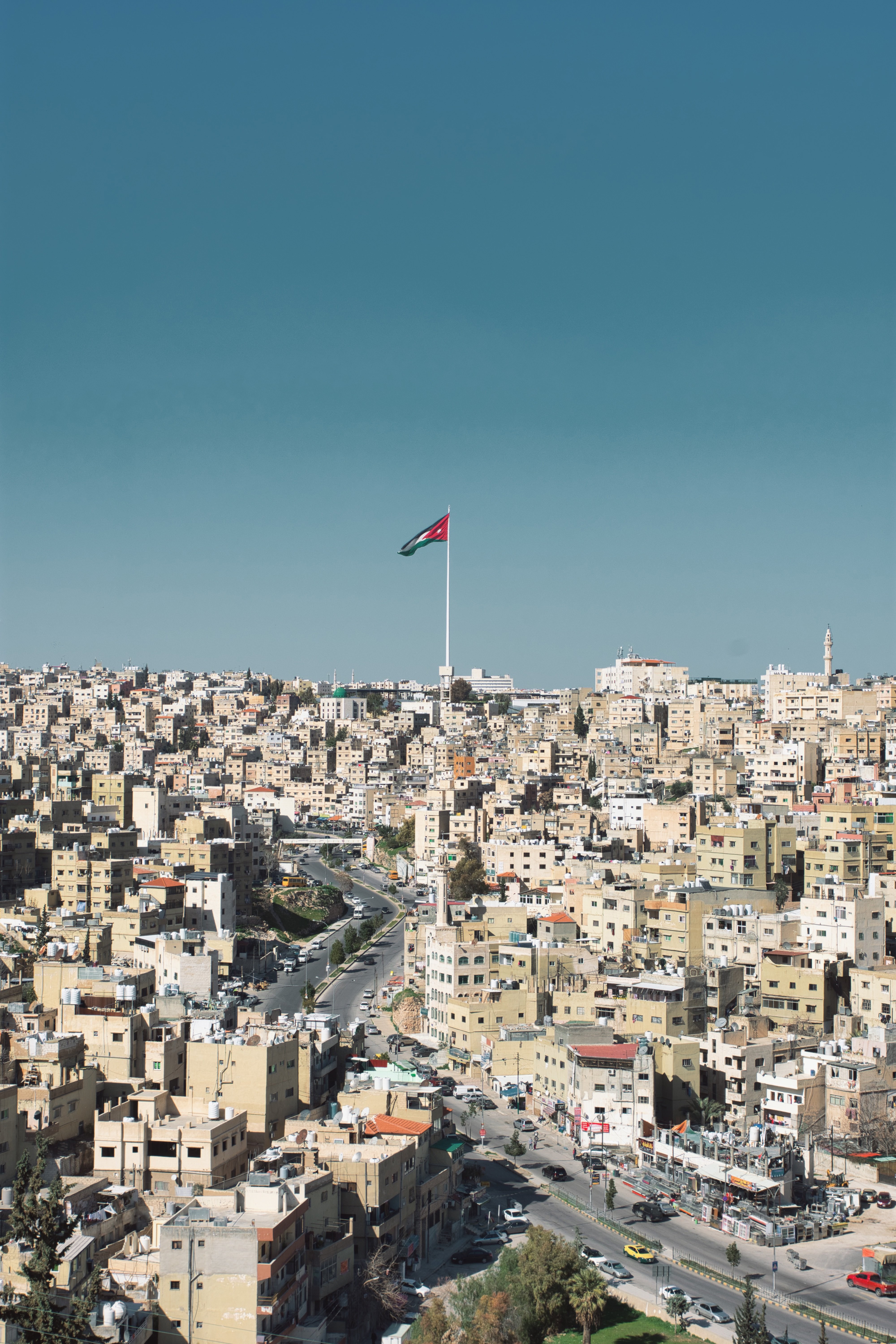 White Square Cityscape Featuring a Flag – Stunning Photo