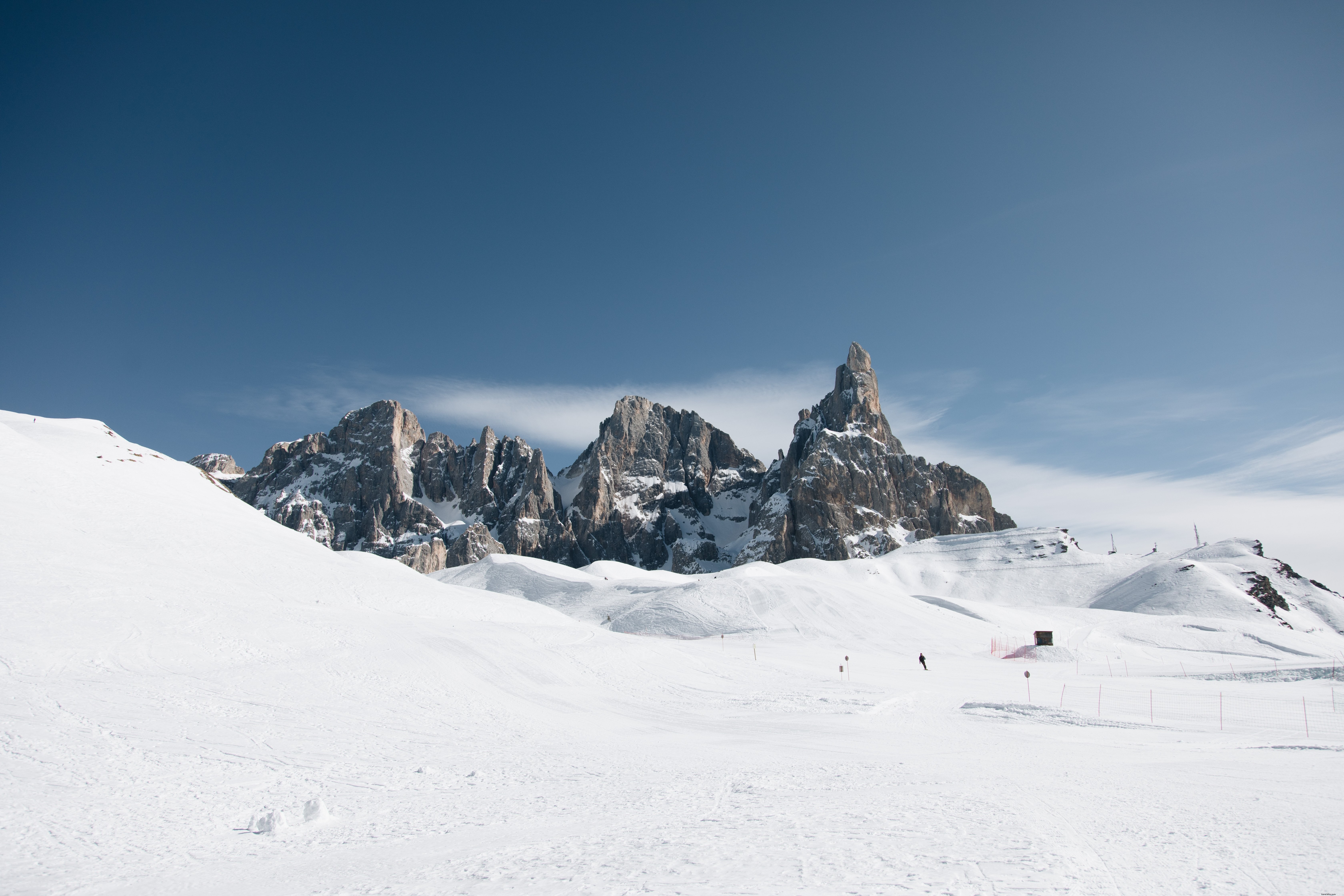 Stunning Ski Tracks at the Base of a Rocky Mountain Range – Captured in Photo