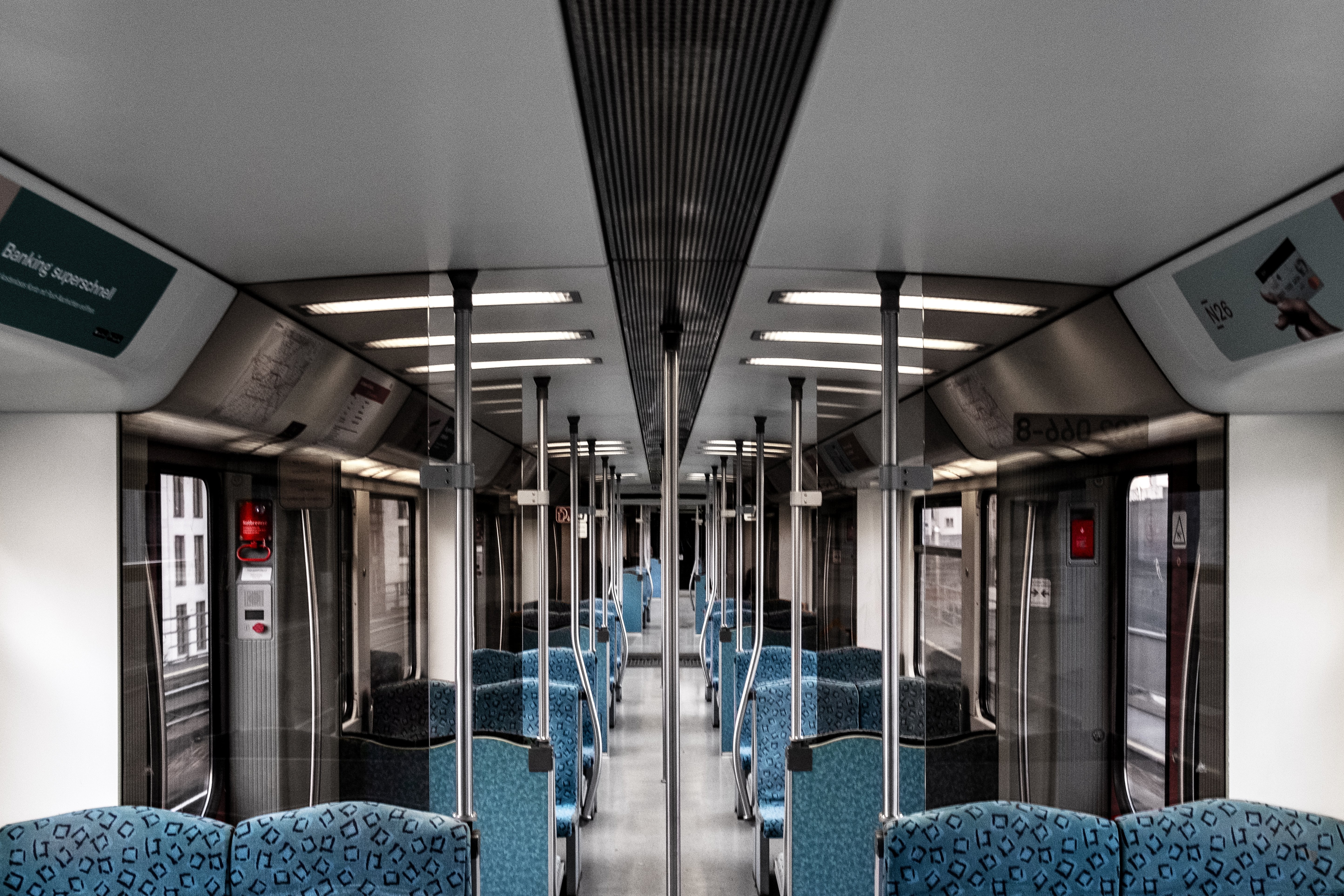 Sunway Train Interior: Blue Seating in an Empty Car
