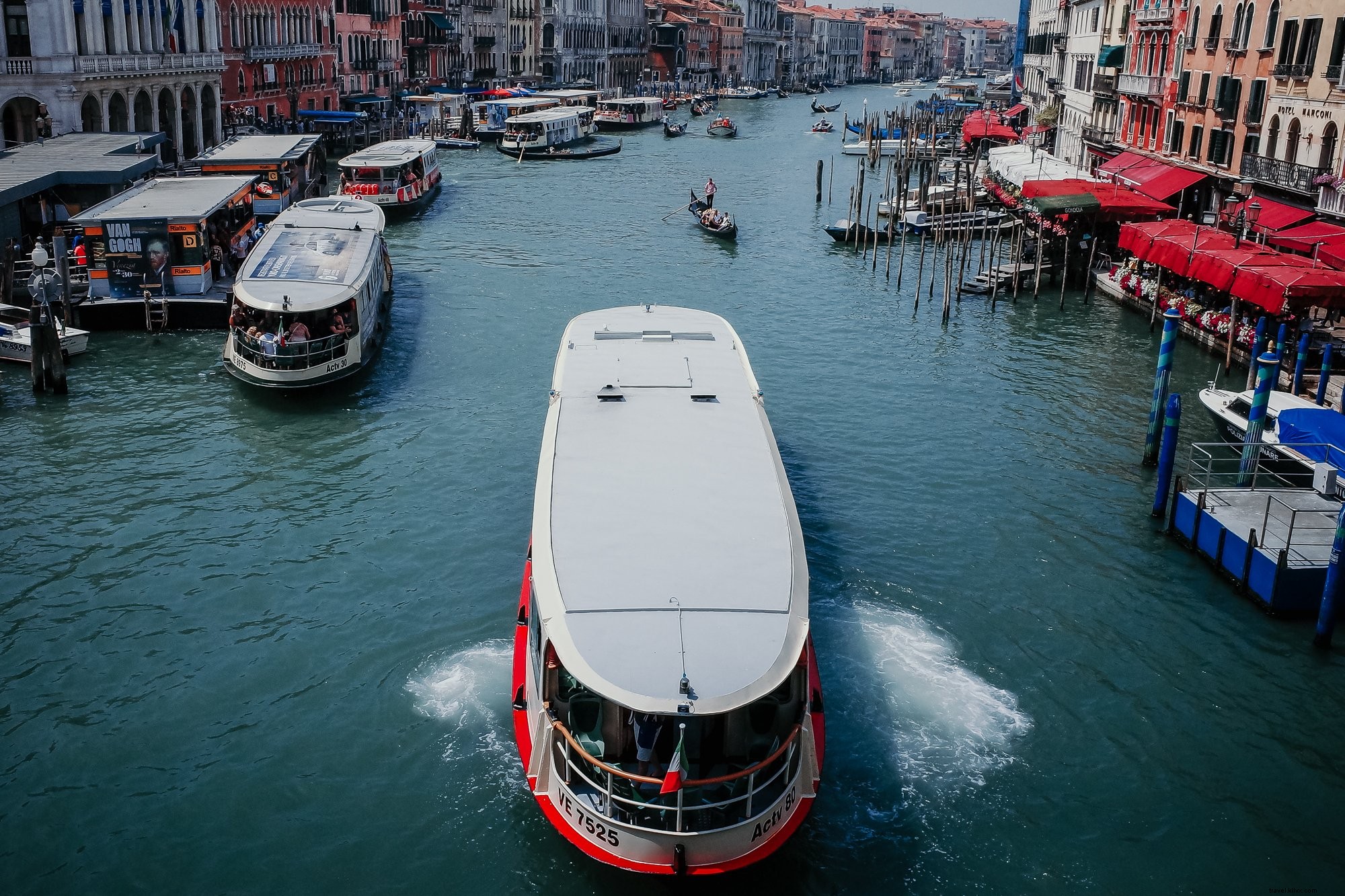 Scenic Waterway: Boats Flotting Amid City Buildings on Both Shores