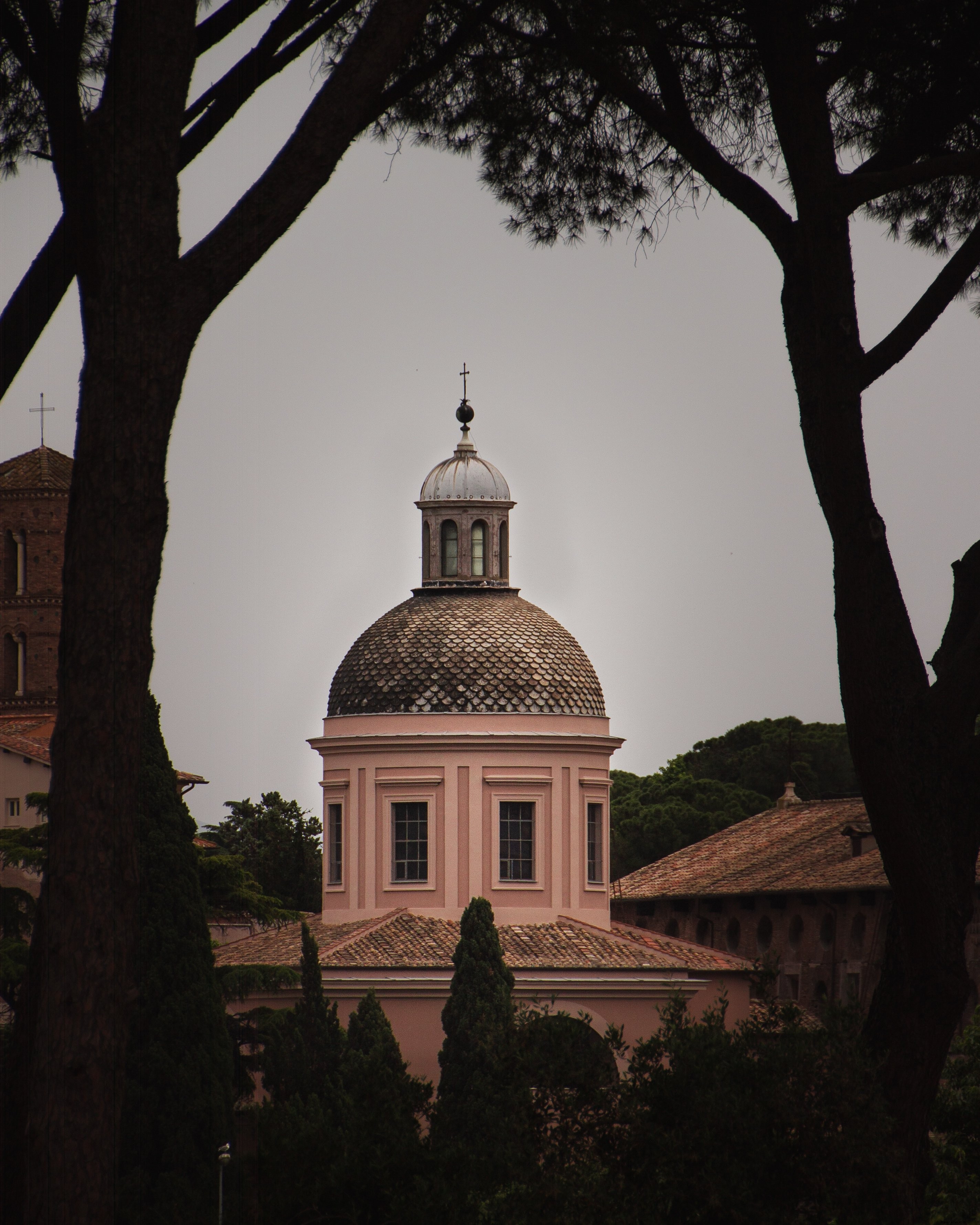 Stunning Crucifix on Spire Amidst a Grey Sky