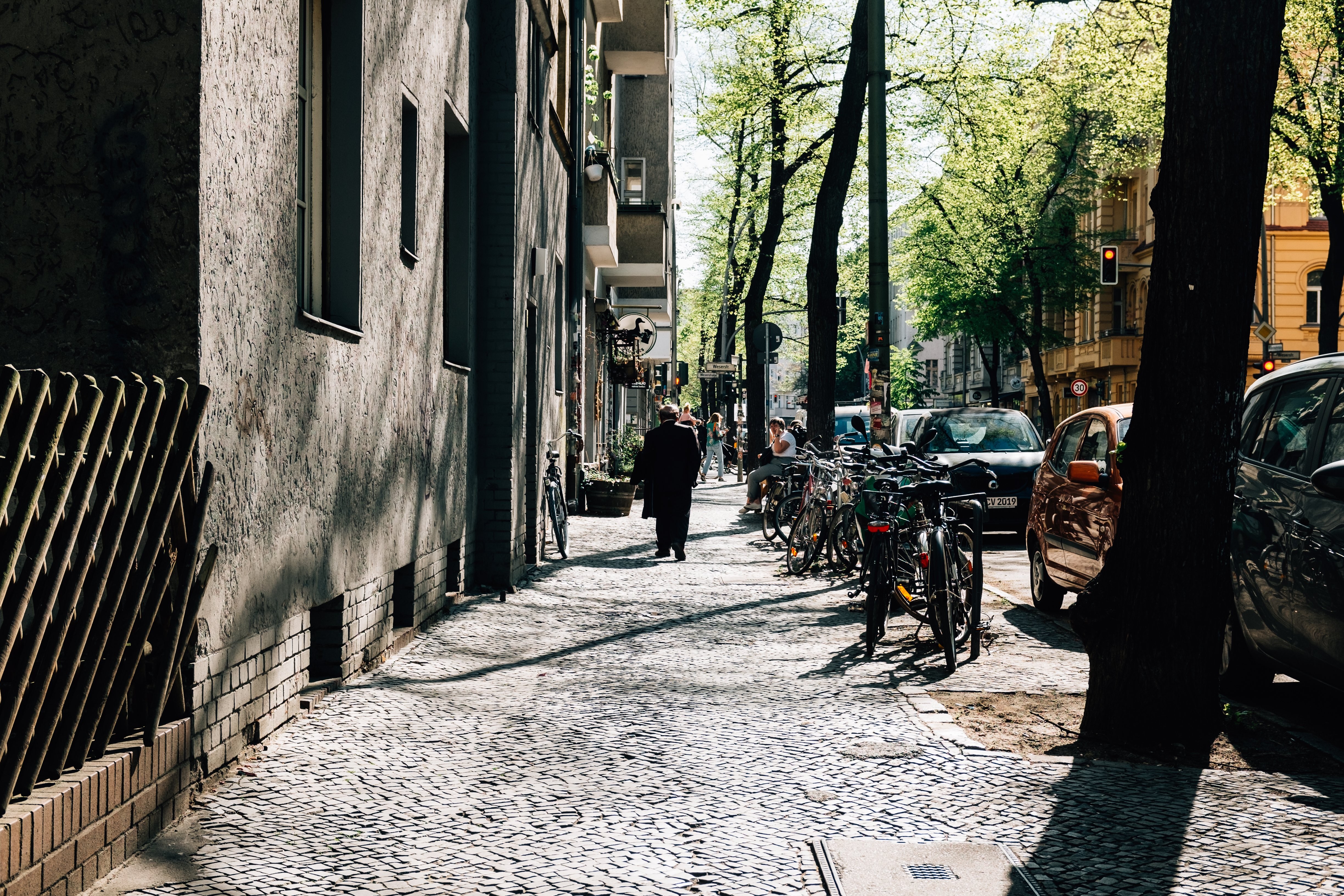 Sunlit Cobbled Street Photo – Capturing Warm Urban Charm