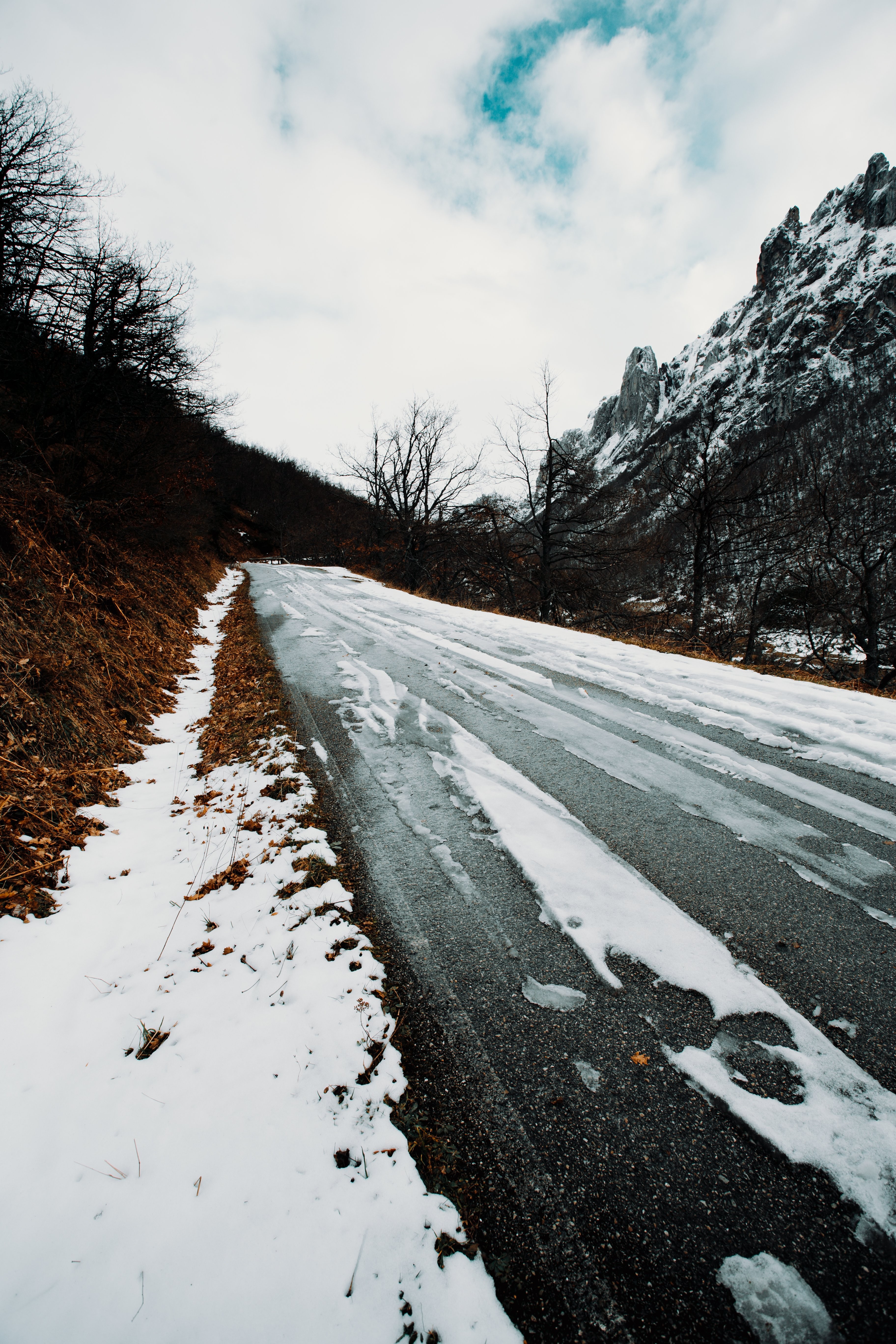 Stunning Winter Road Scene: Slush-Covered Path in Solitude