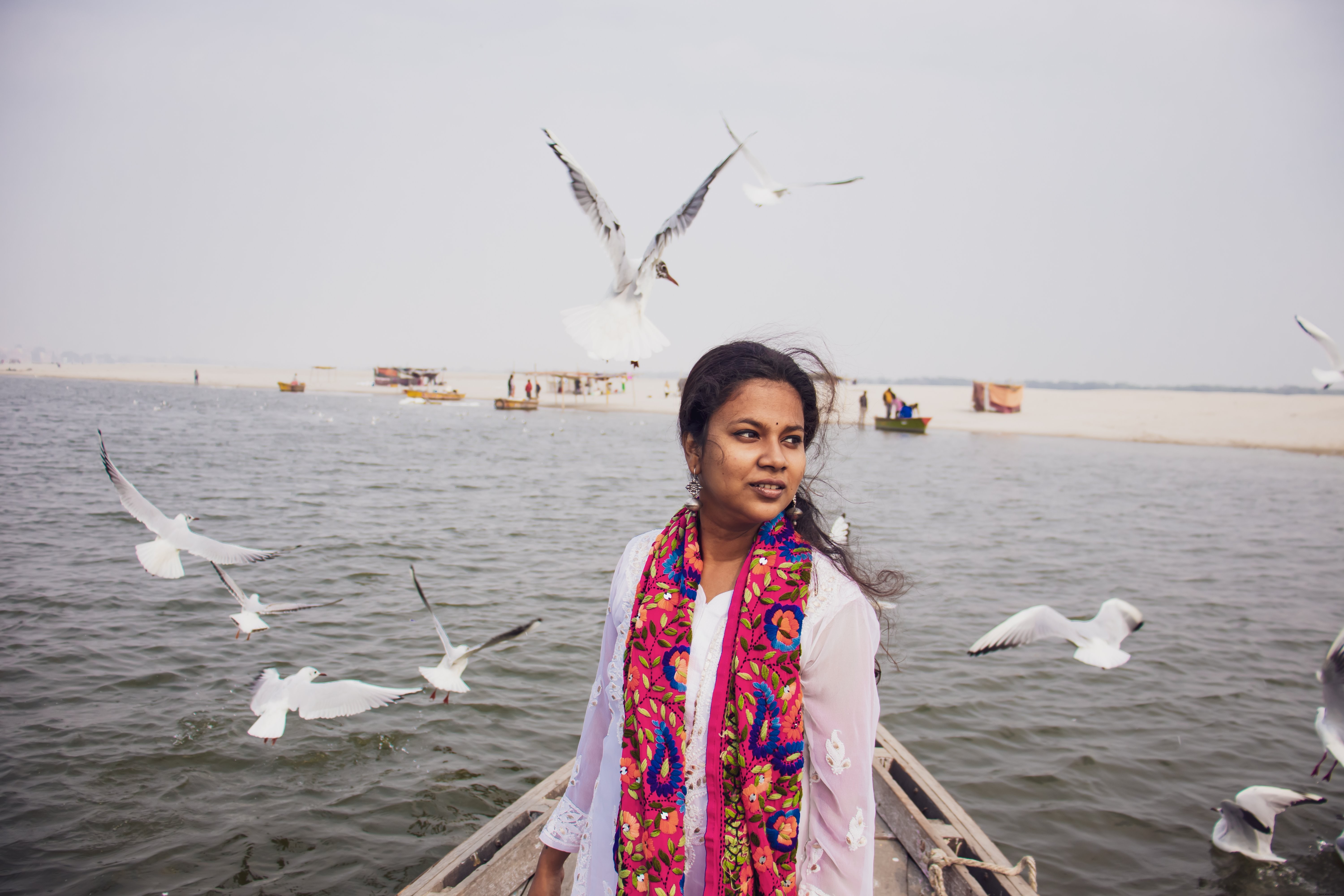 Sailor Captured Amidst a Flock of Birds on a Boat