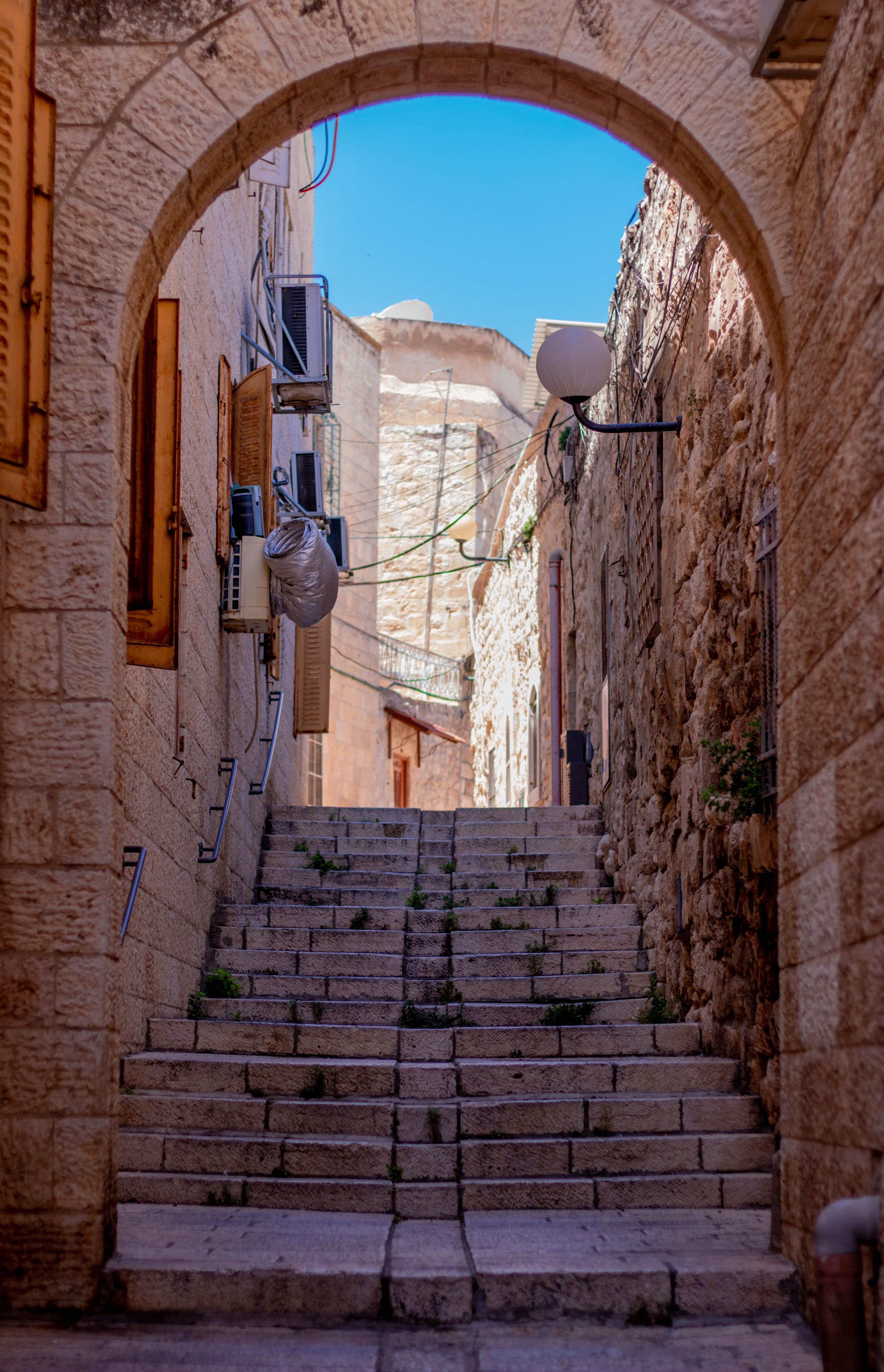 Elegant Stone Staircase and Archway Leading Into Historic Alley – Stunning Photo