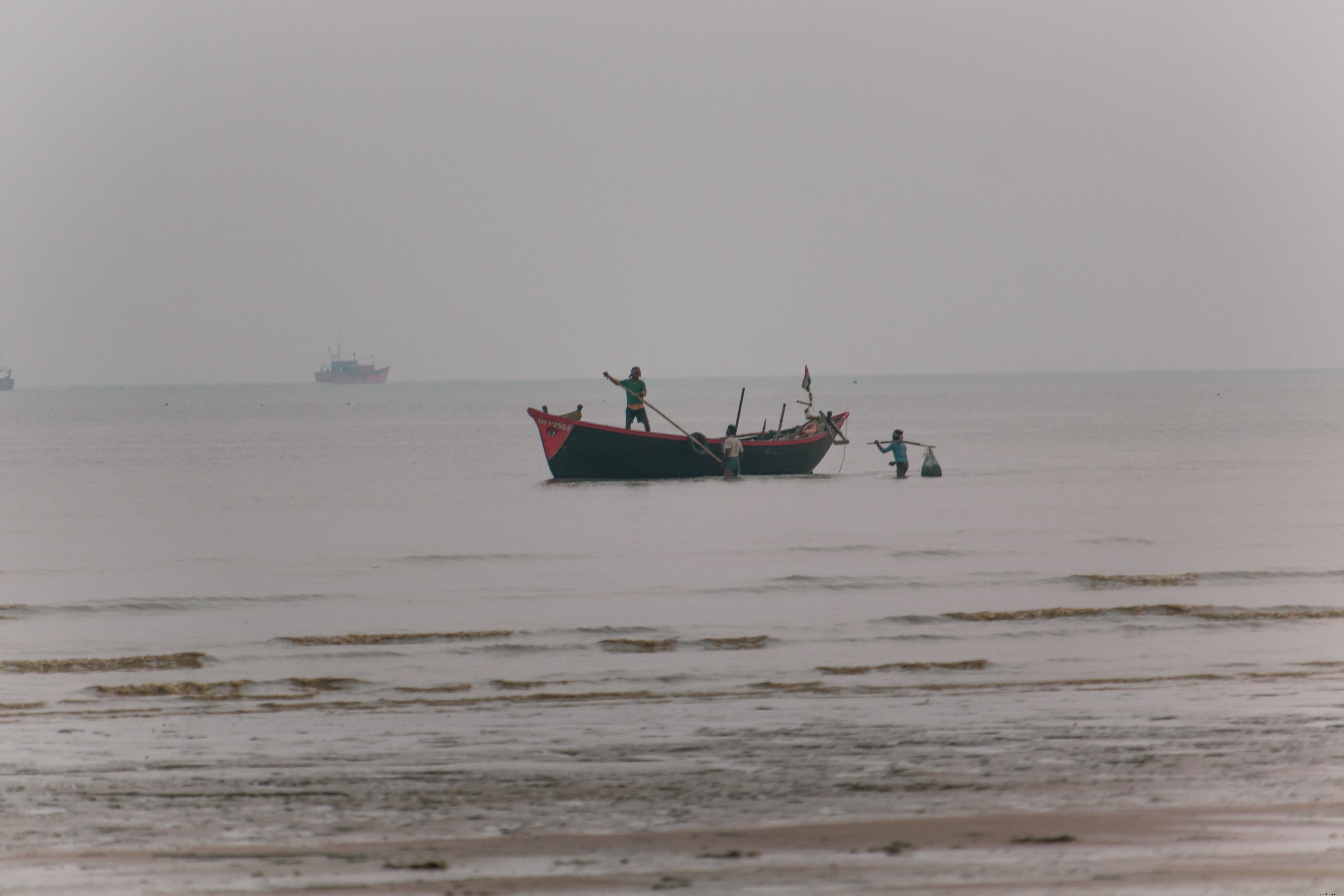 Stunning Shoreline Photo of Fishermen at Work