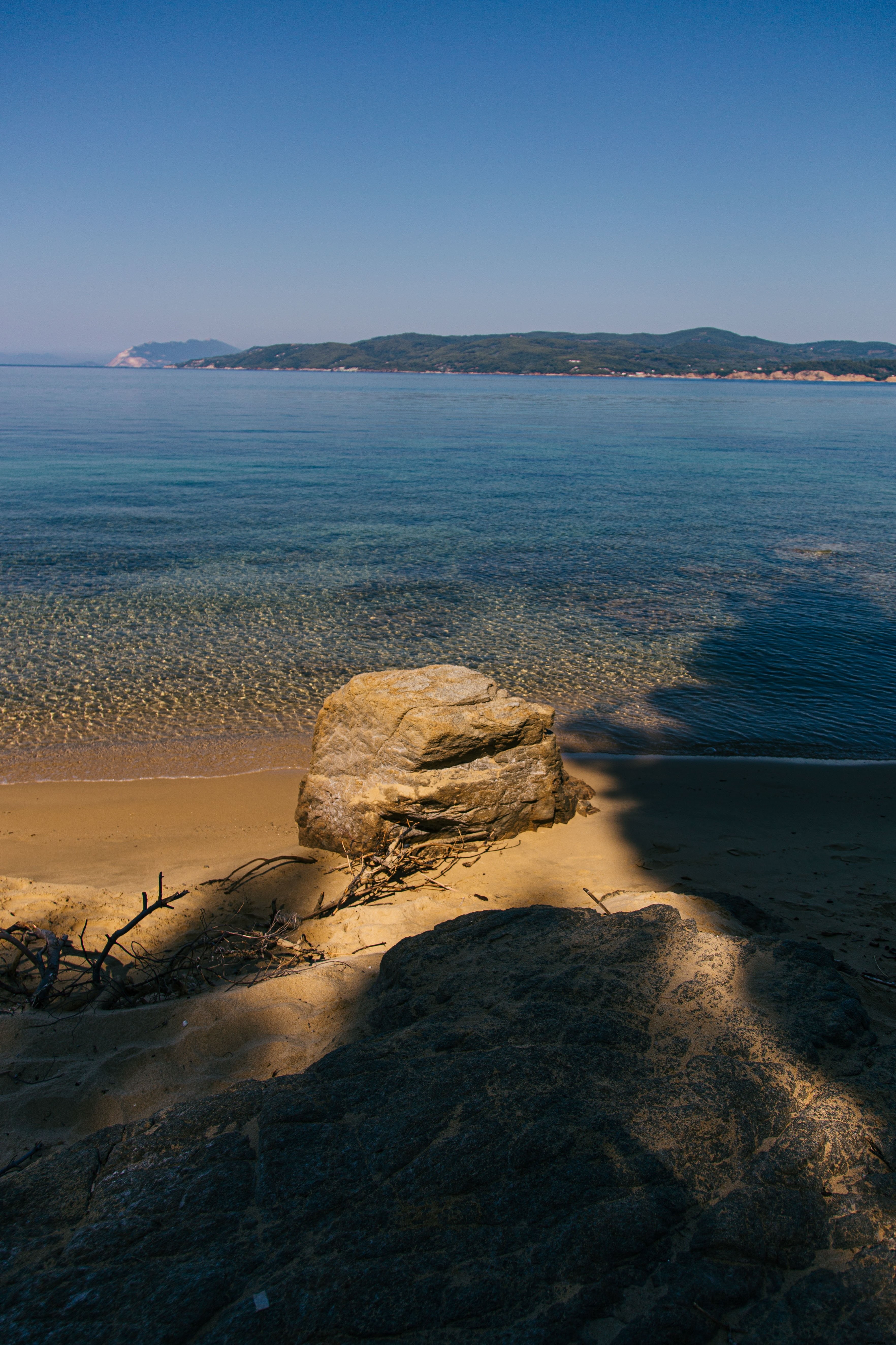 Stunning Seashore Shot: A Rock Poised on Sandy Shore