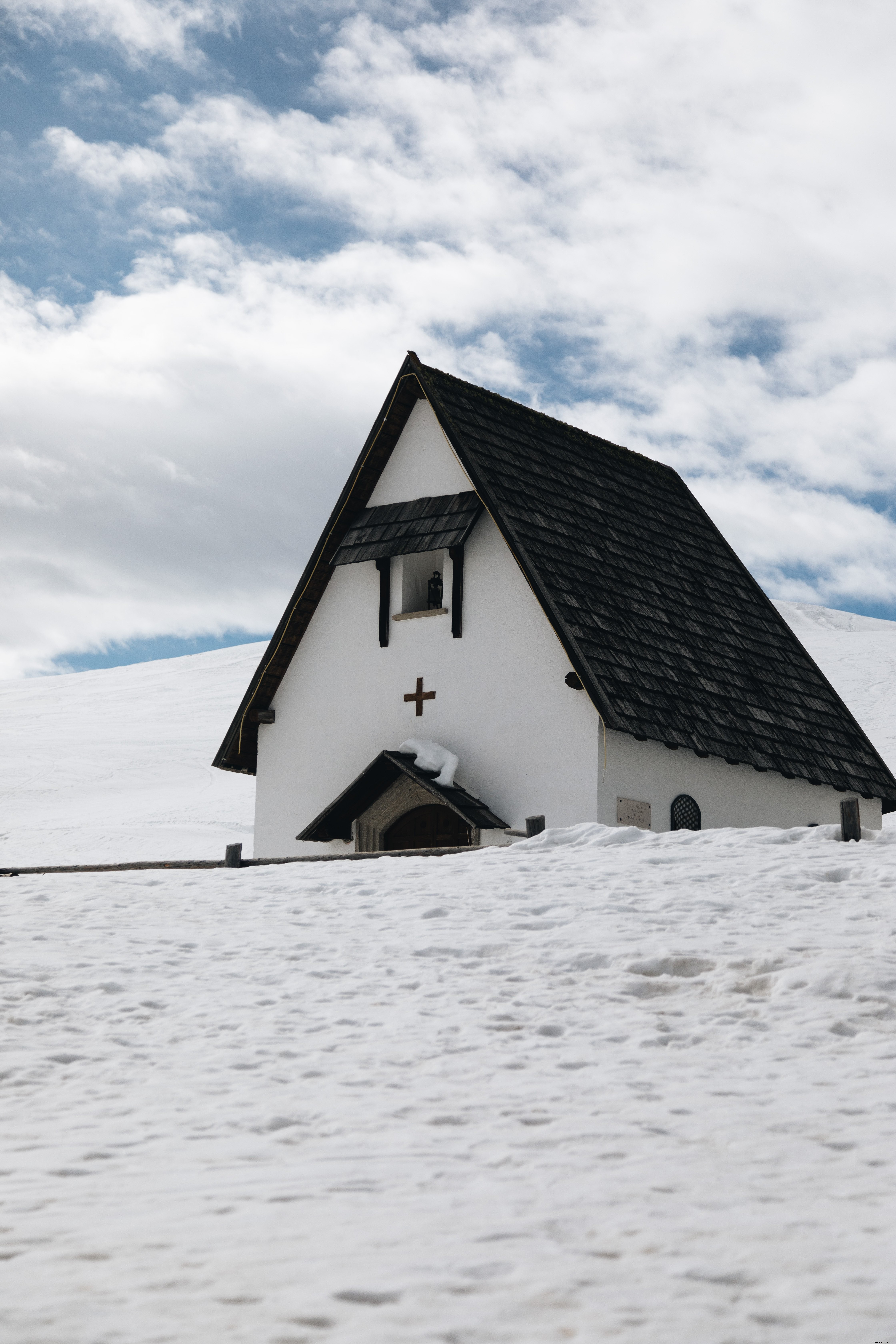 Elegant Black and White Building Amidst Snow – Stunning Architectural Photography