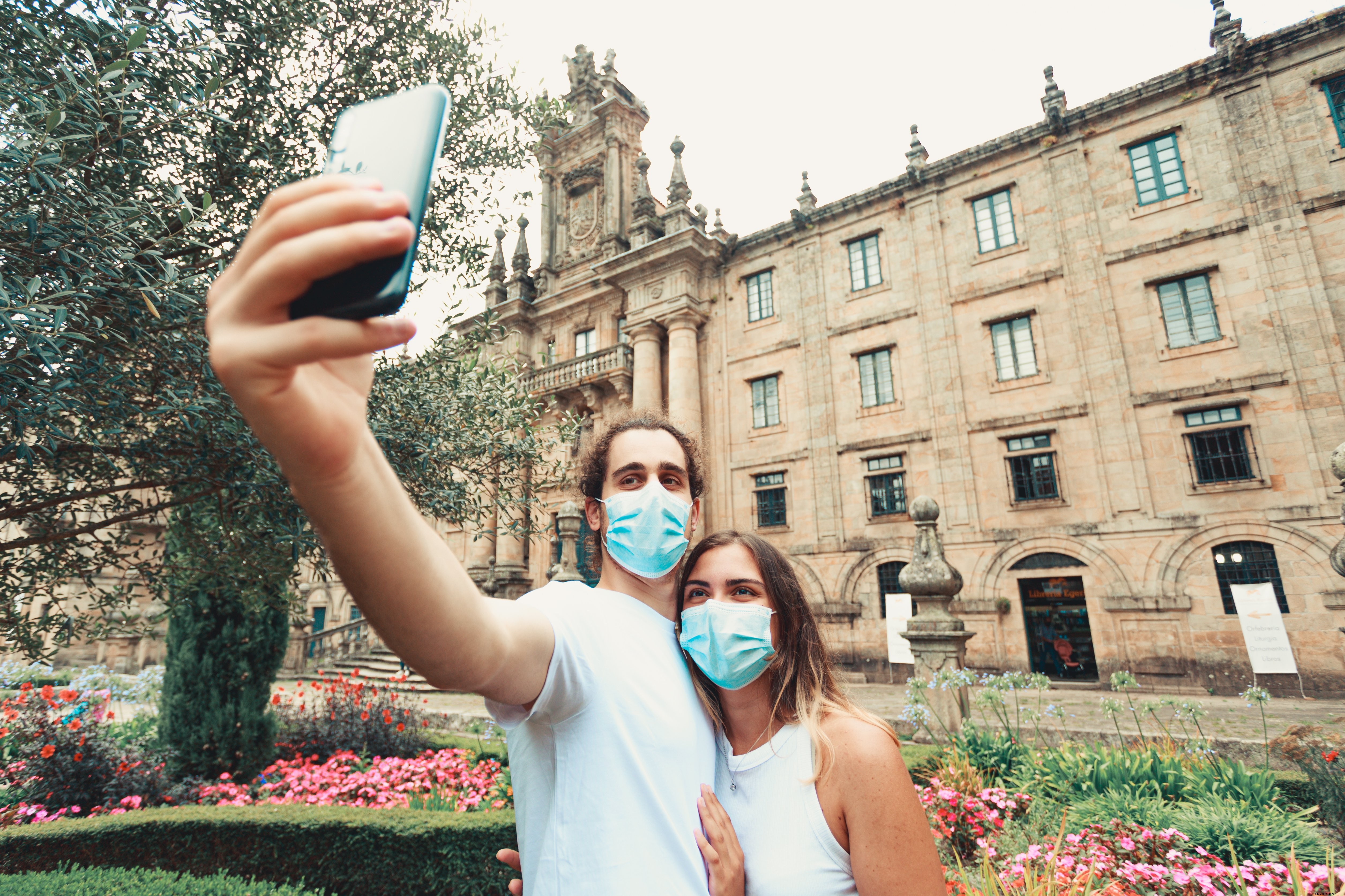 Outdoor Selfie of Two People in Blue Face Masks – Safe Photo Moment