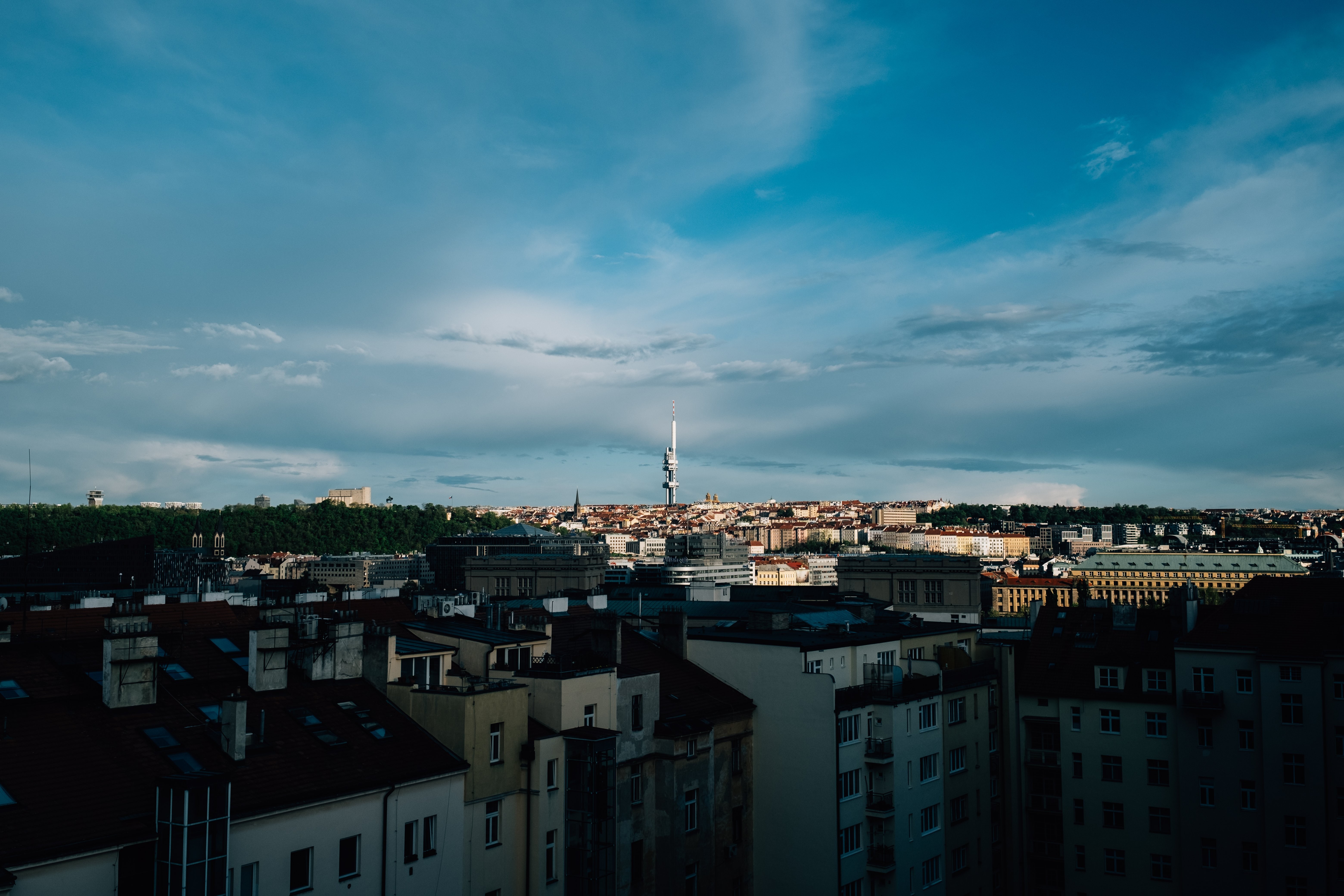 Stunning Cityscape Photo Featuring a Tower Amid Shadows