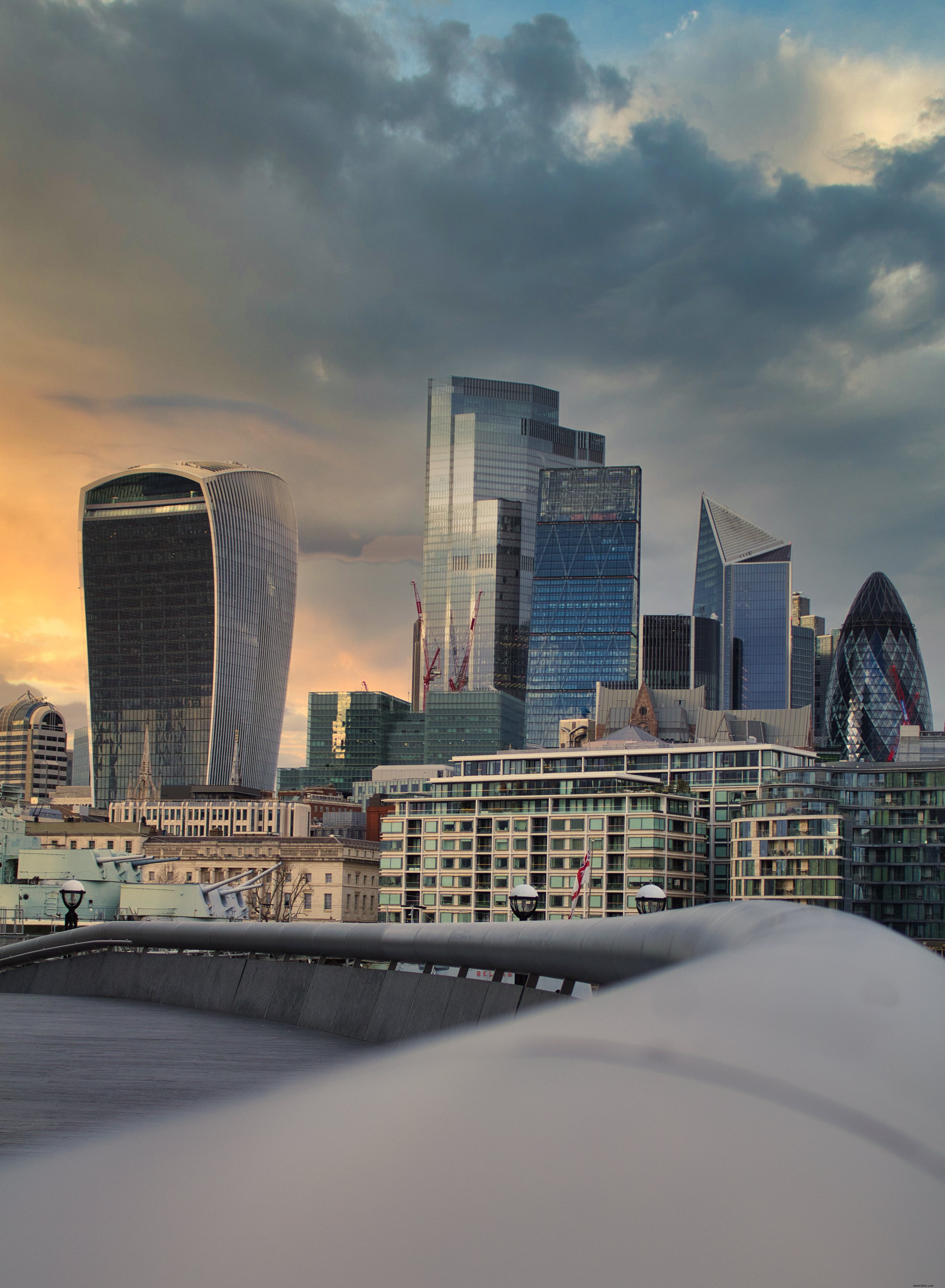 Stunning London Skyline: Cloudy Sunset Over Glass Towers