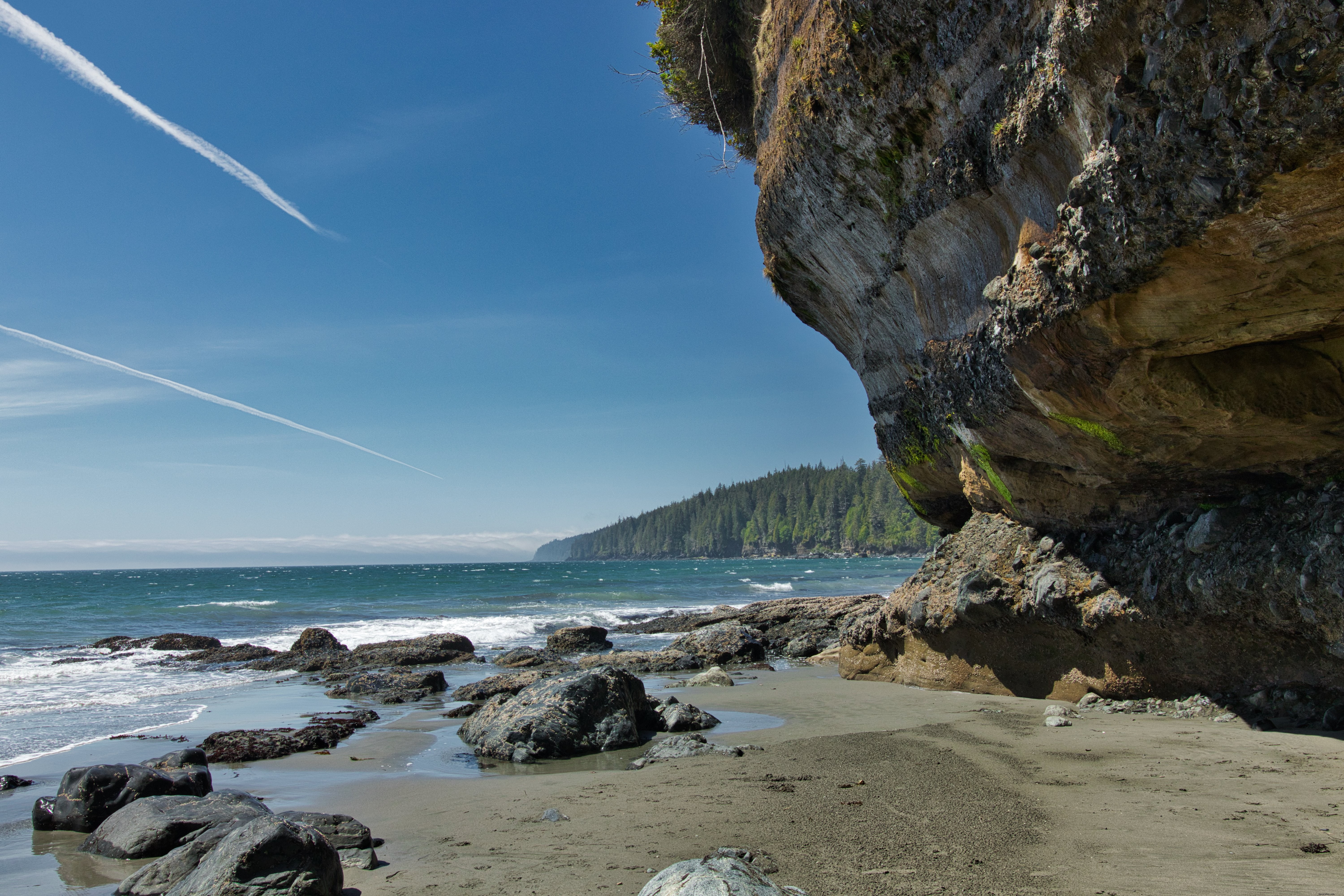 Rocky Cliff Over Sandy Beach and Crystal Blue Waters