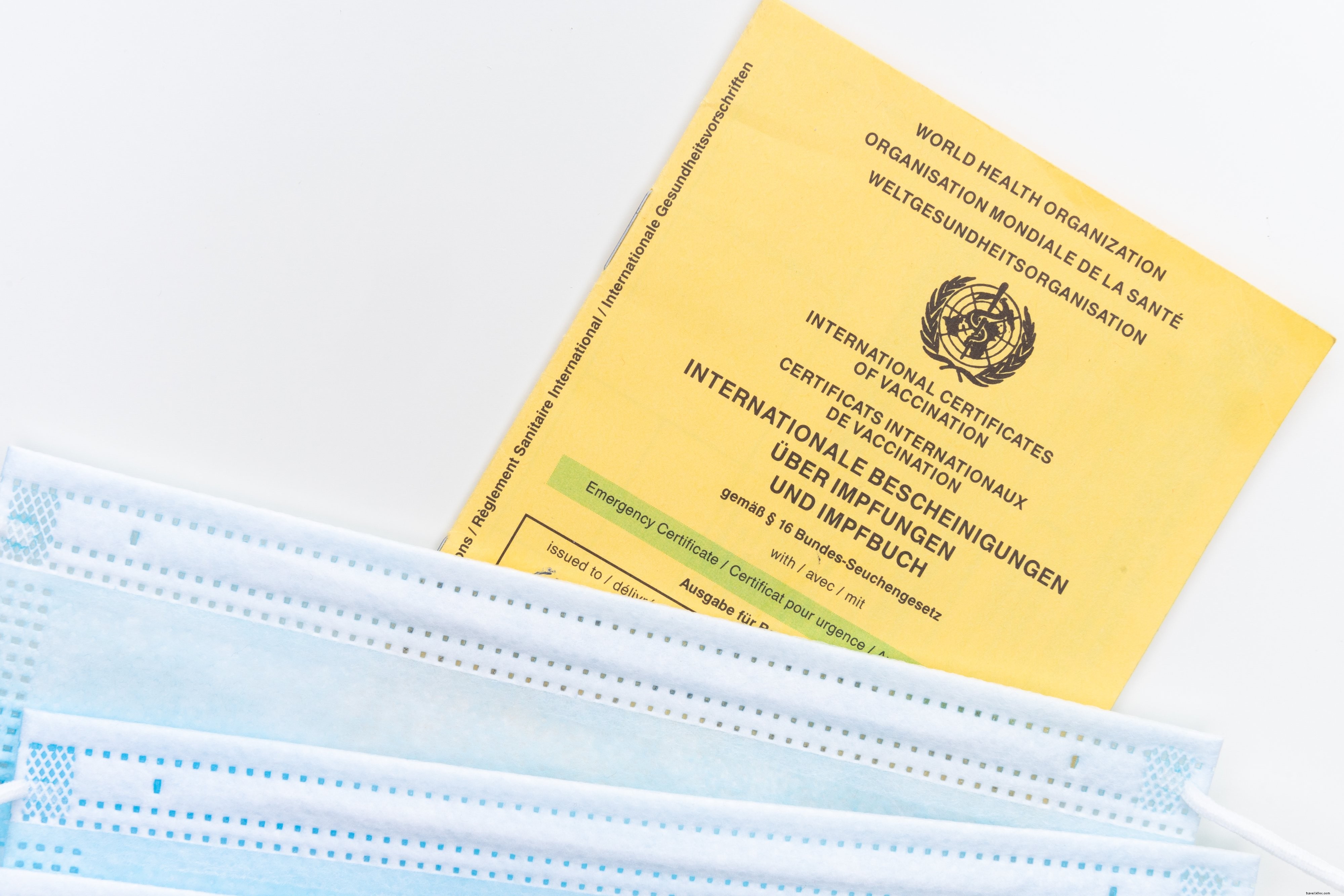 Yellow Vaccination Card with Face Masks – A Clear Flatlay Illustration