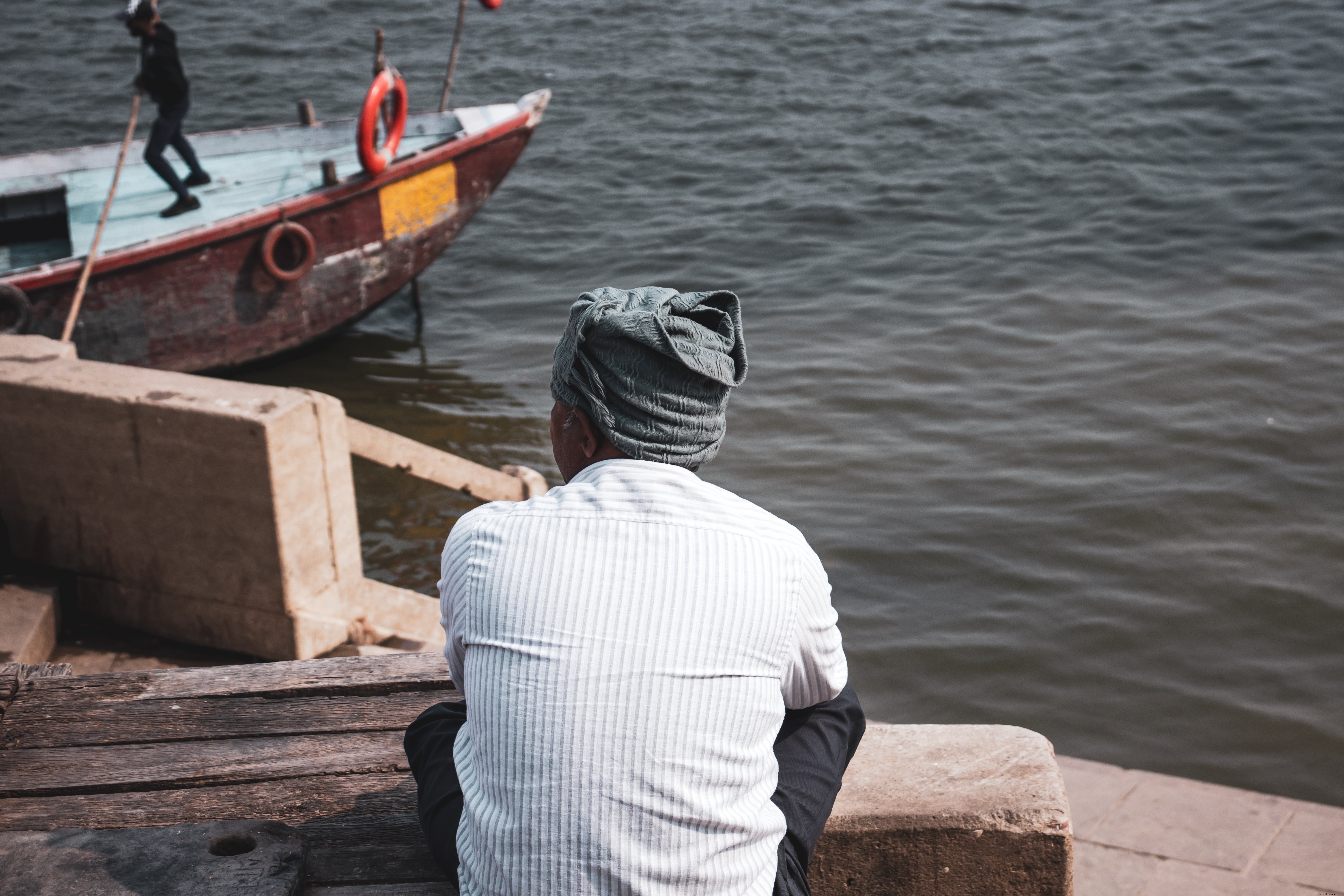 Serene Portrait: Person in Scarf Gazing Over Water