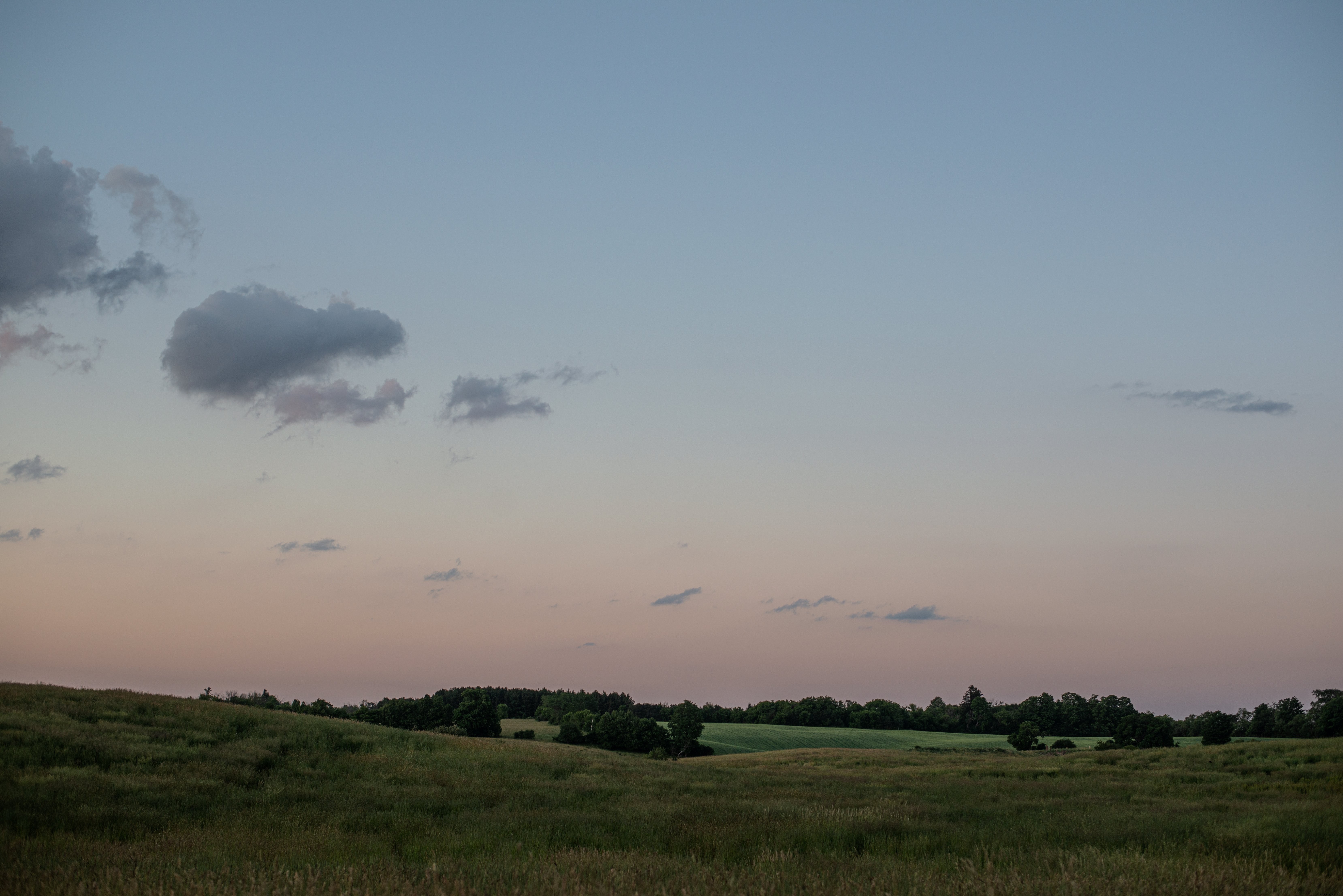 Summer Sunset Over Rolling Green Hills