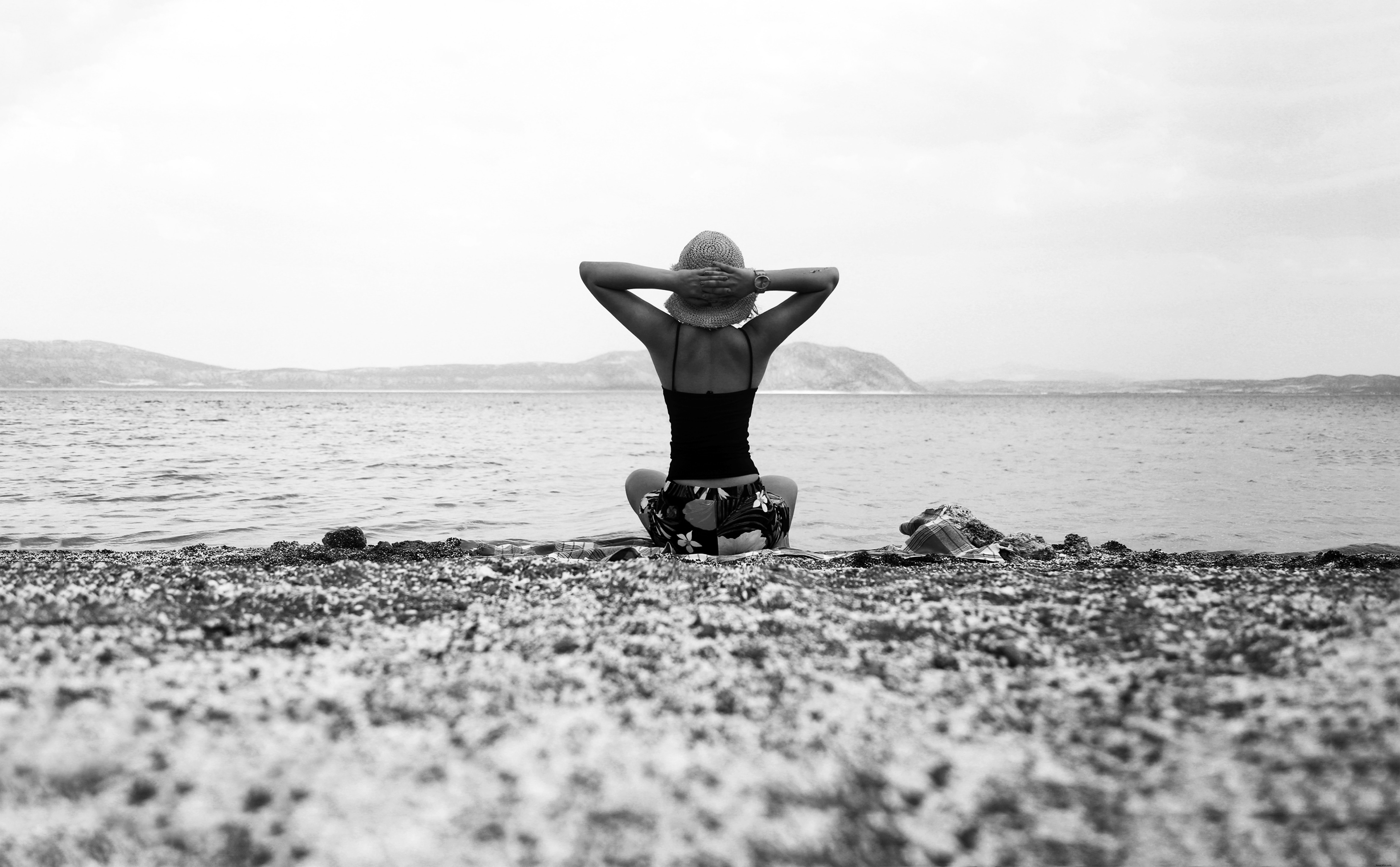 Classic Black‑and‑White Beach Portrait: Person Raising Hands