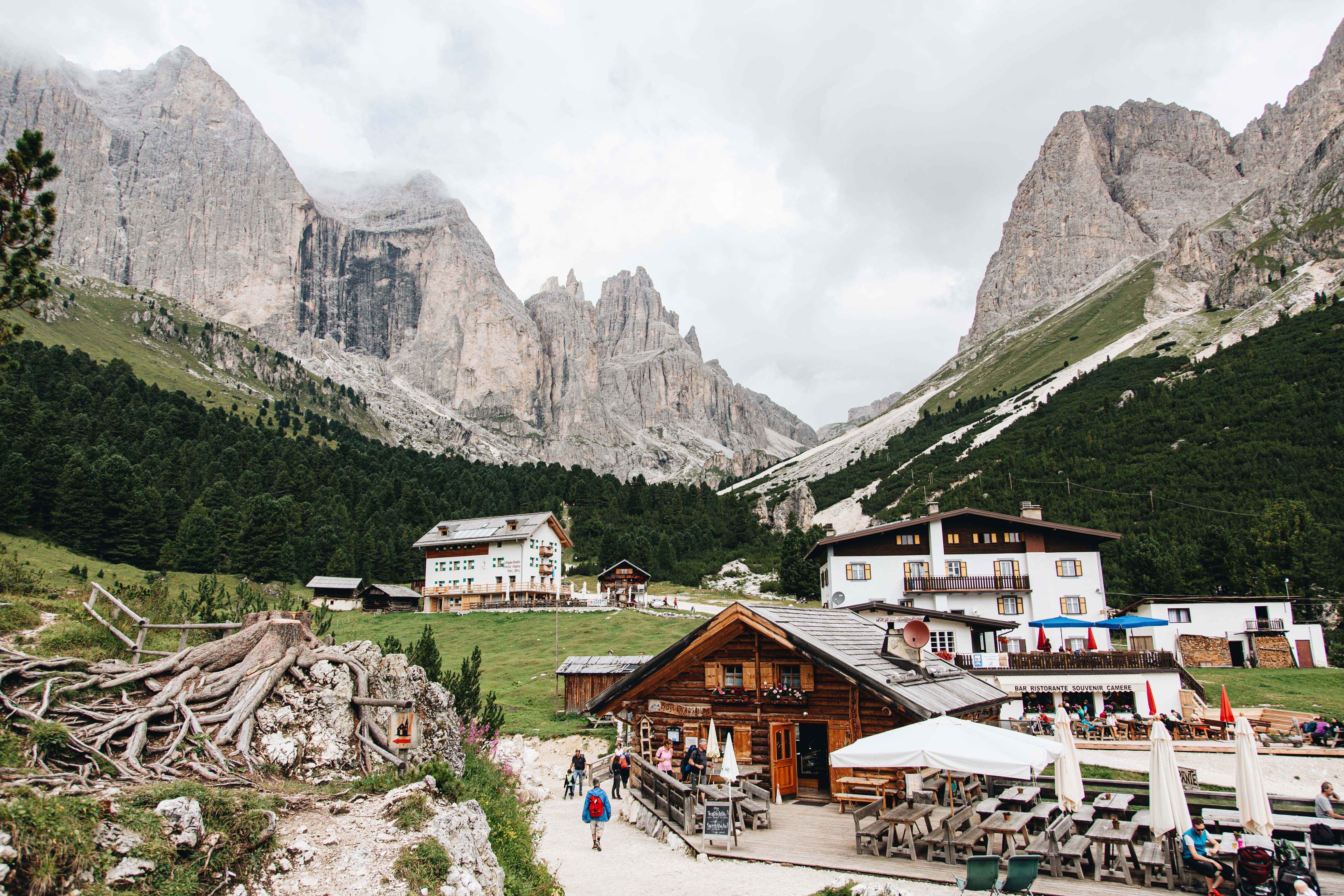Serene Sky: Clouds Drift Over Mountains Above a Valley Town