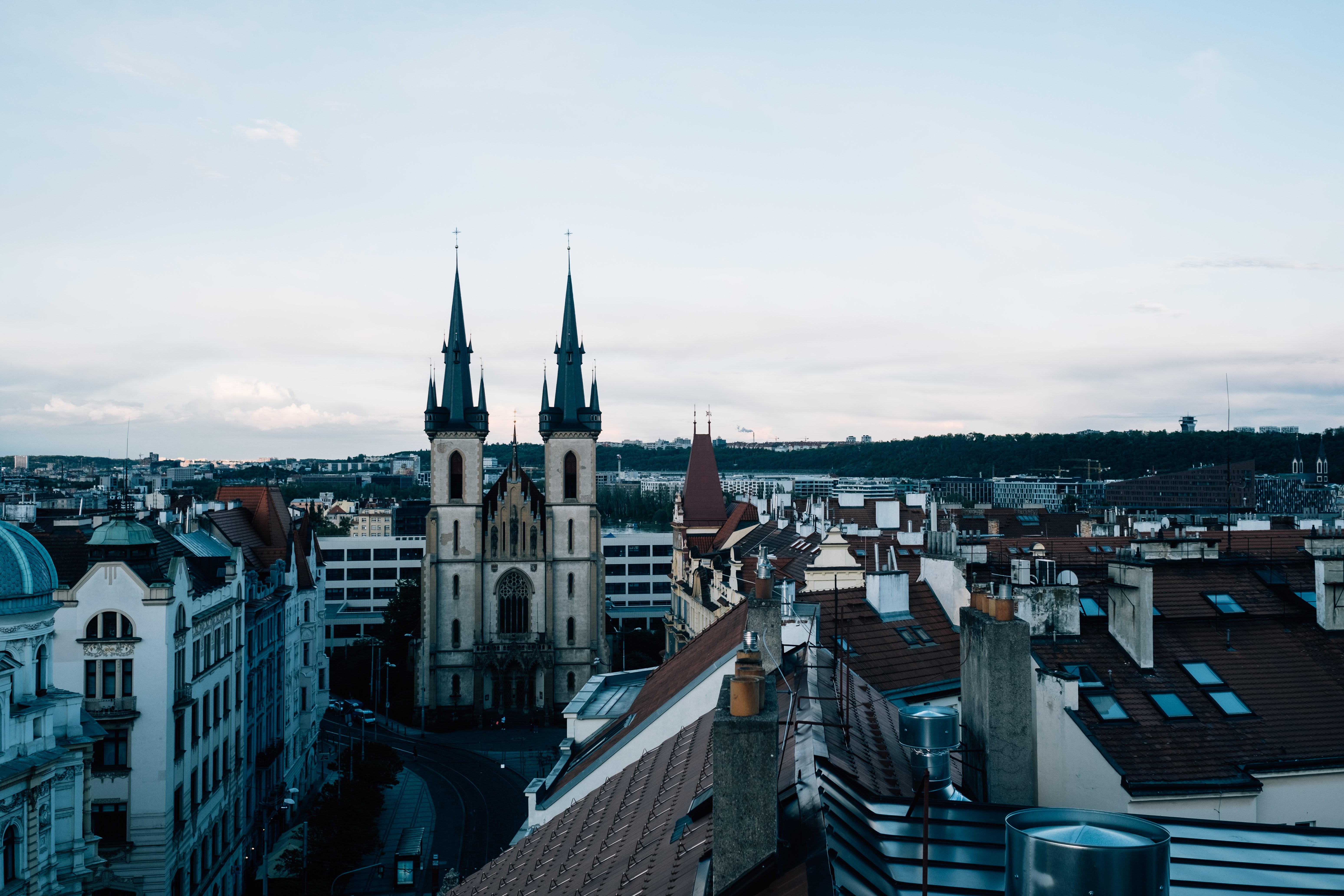 Cityscape Photo: Church Stands Between Towering Buildings
