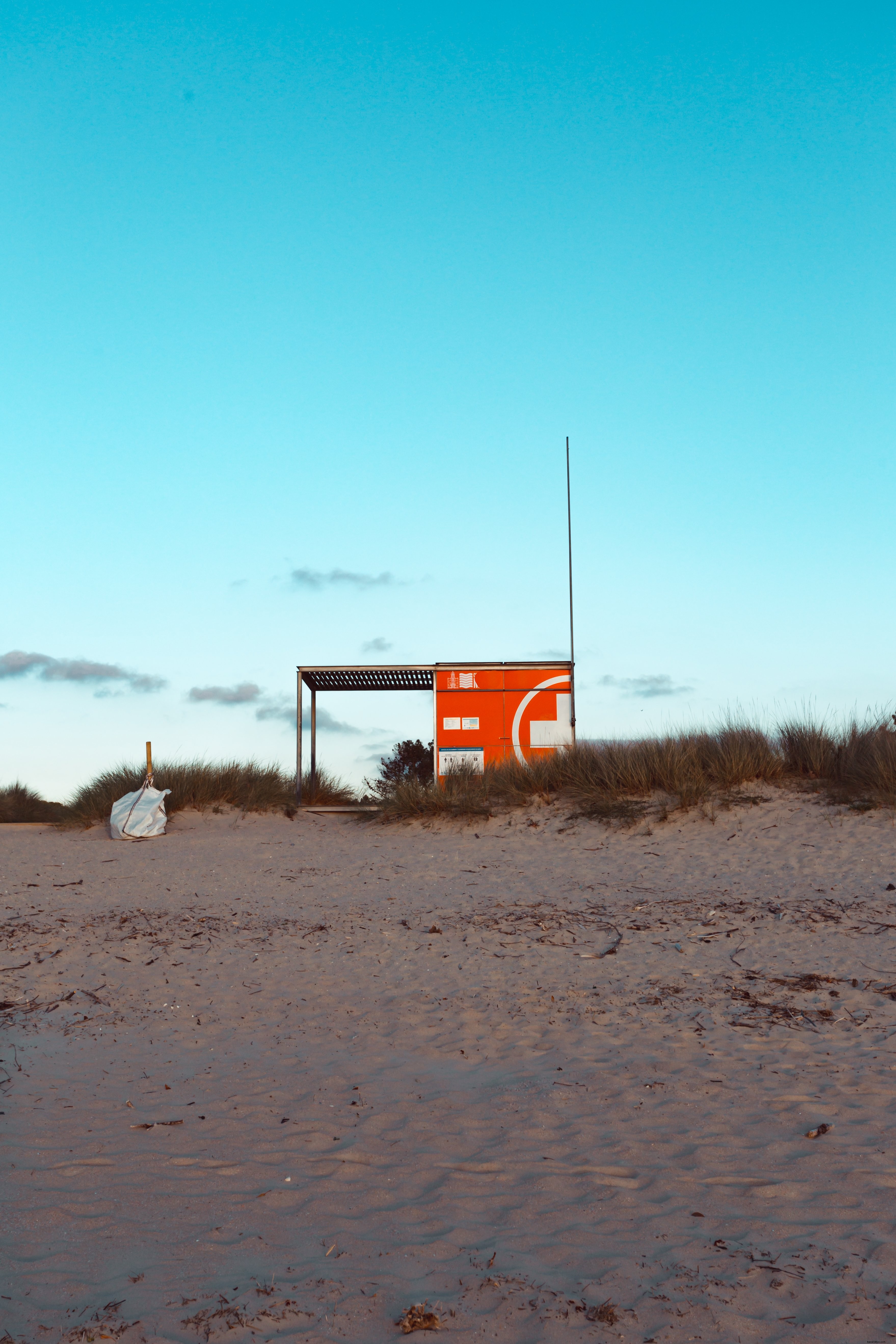 Photograph of Sand Landscape Featuring a Central Metal Structure