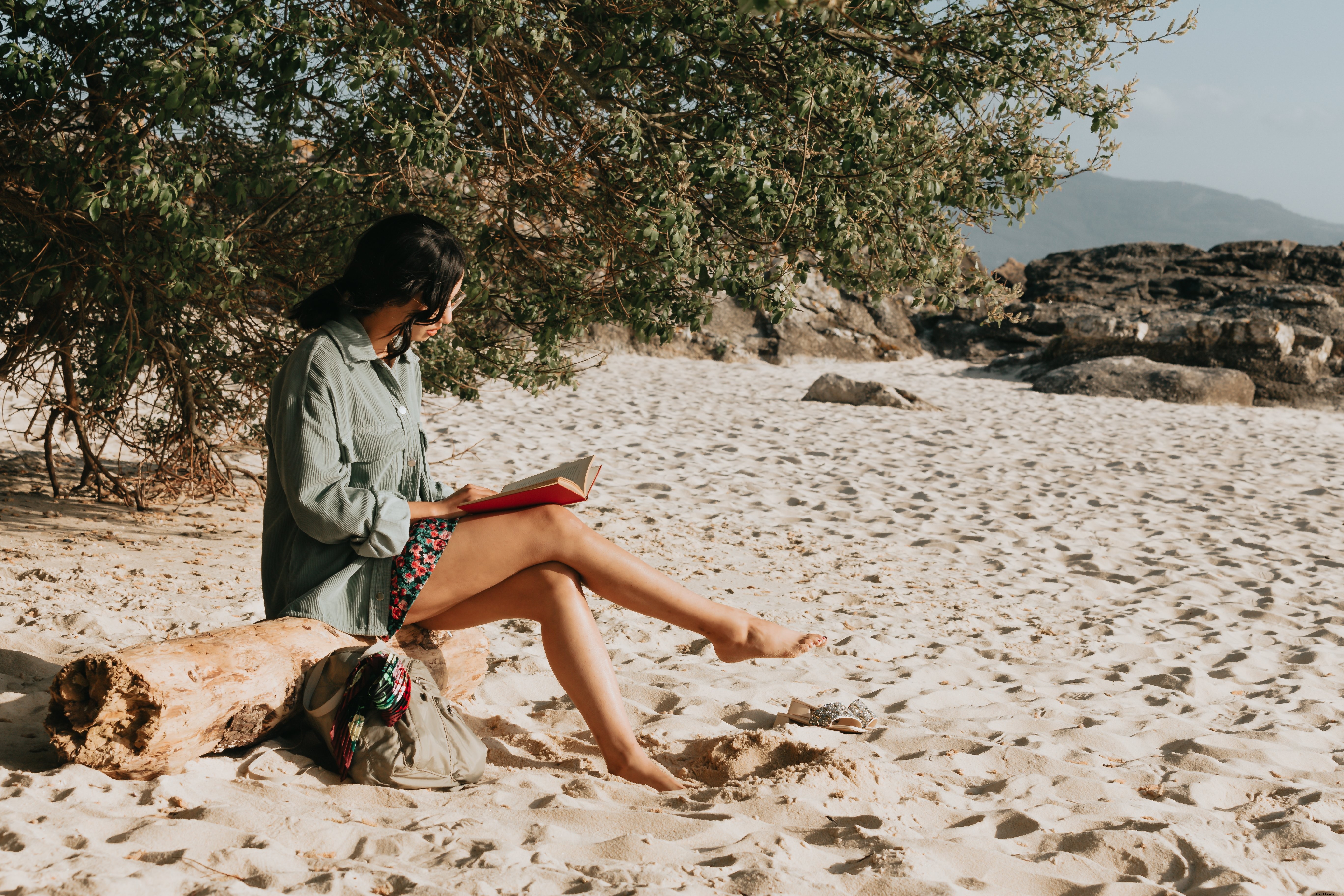 Reading a Novel on a Sandy Beach: A Tranquil Escape