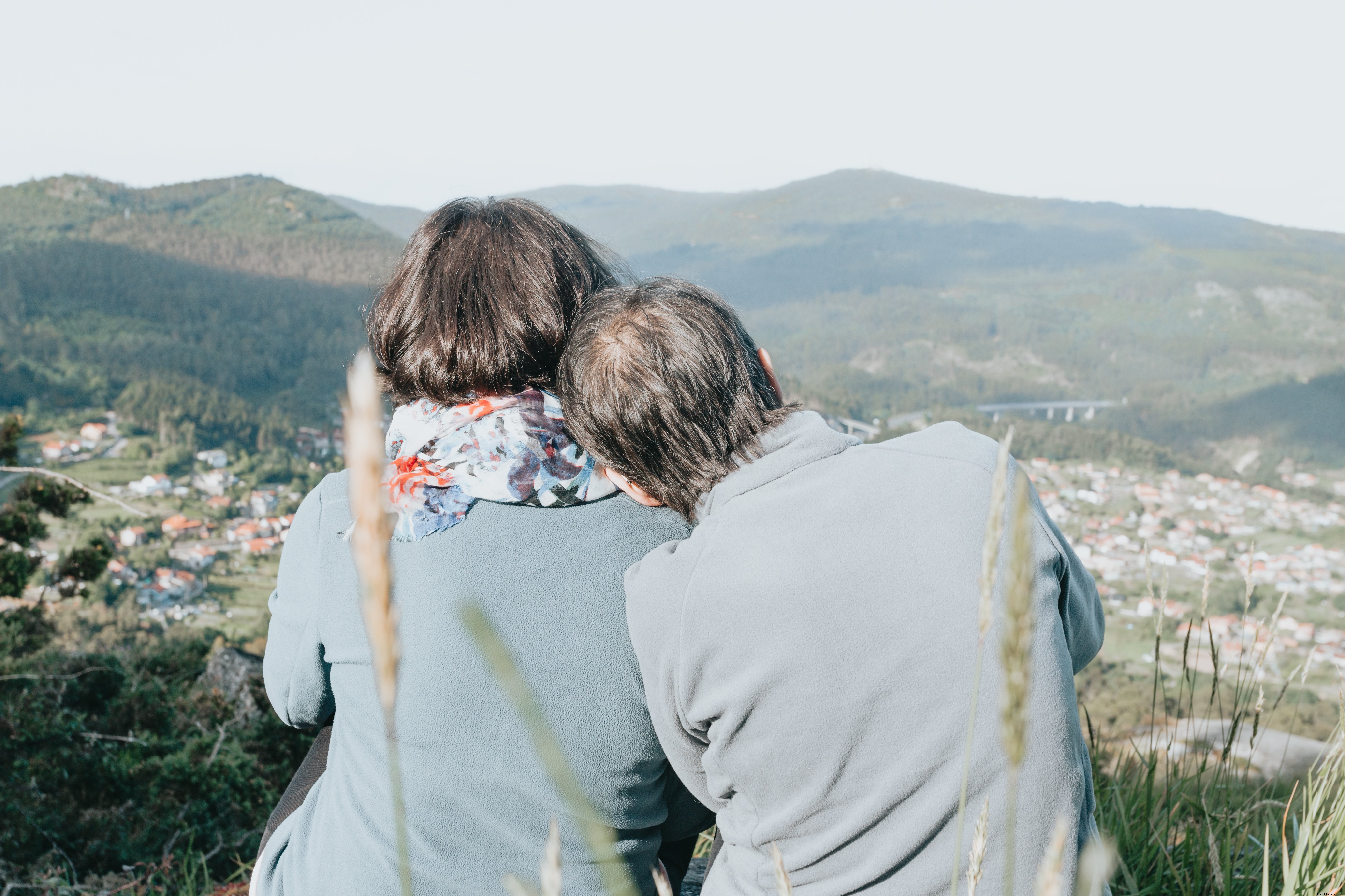 Two Individuals Enjoy a Panoramic Landscape – A Photo from Afar