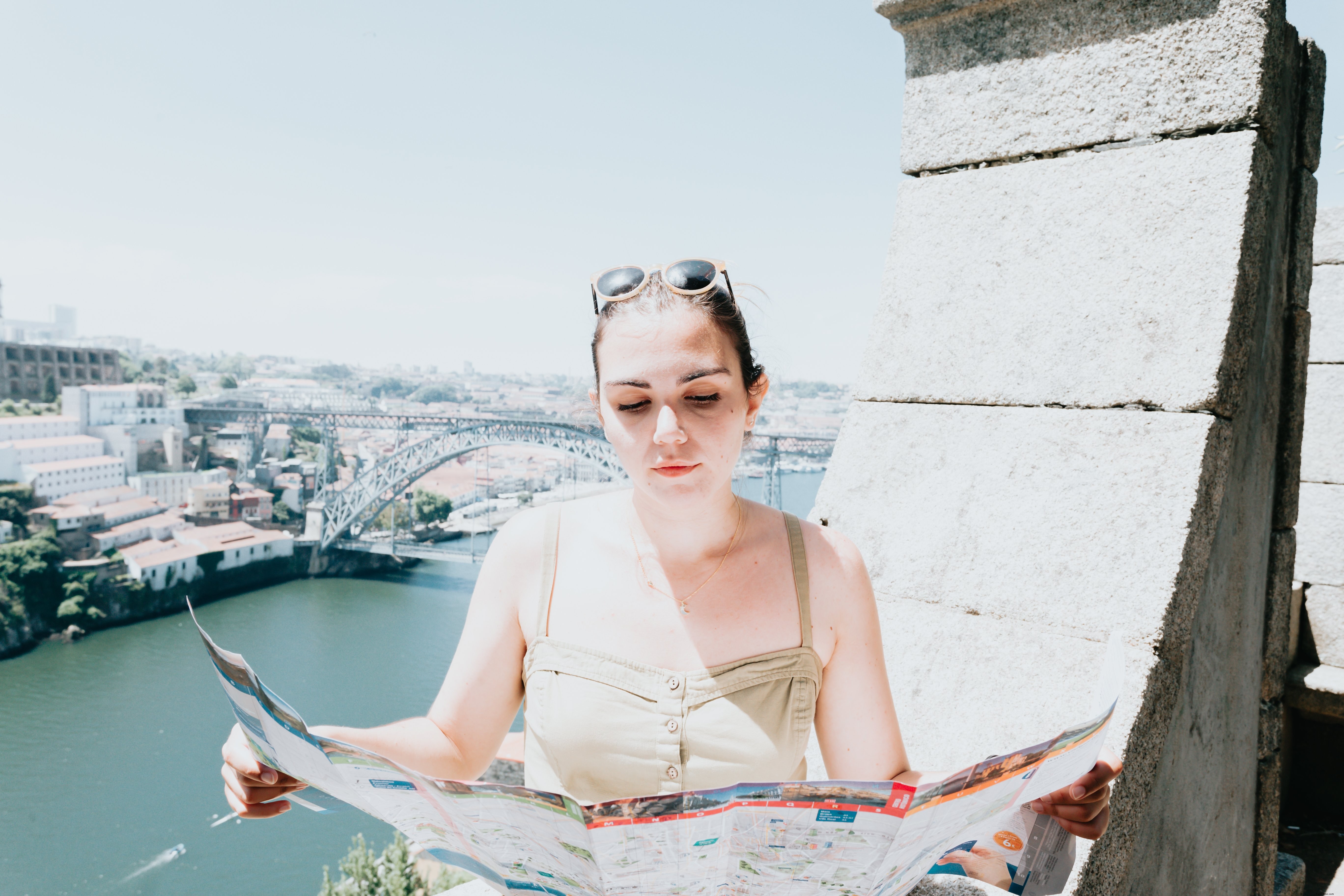 Woman Studies City Map in Both Hands: A Snapshot of Urban Exploration