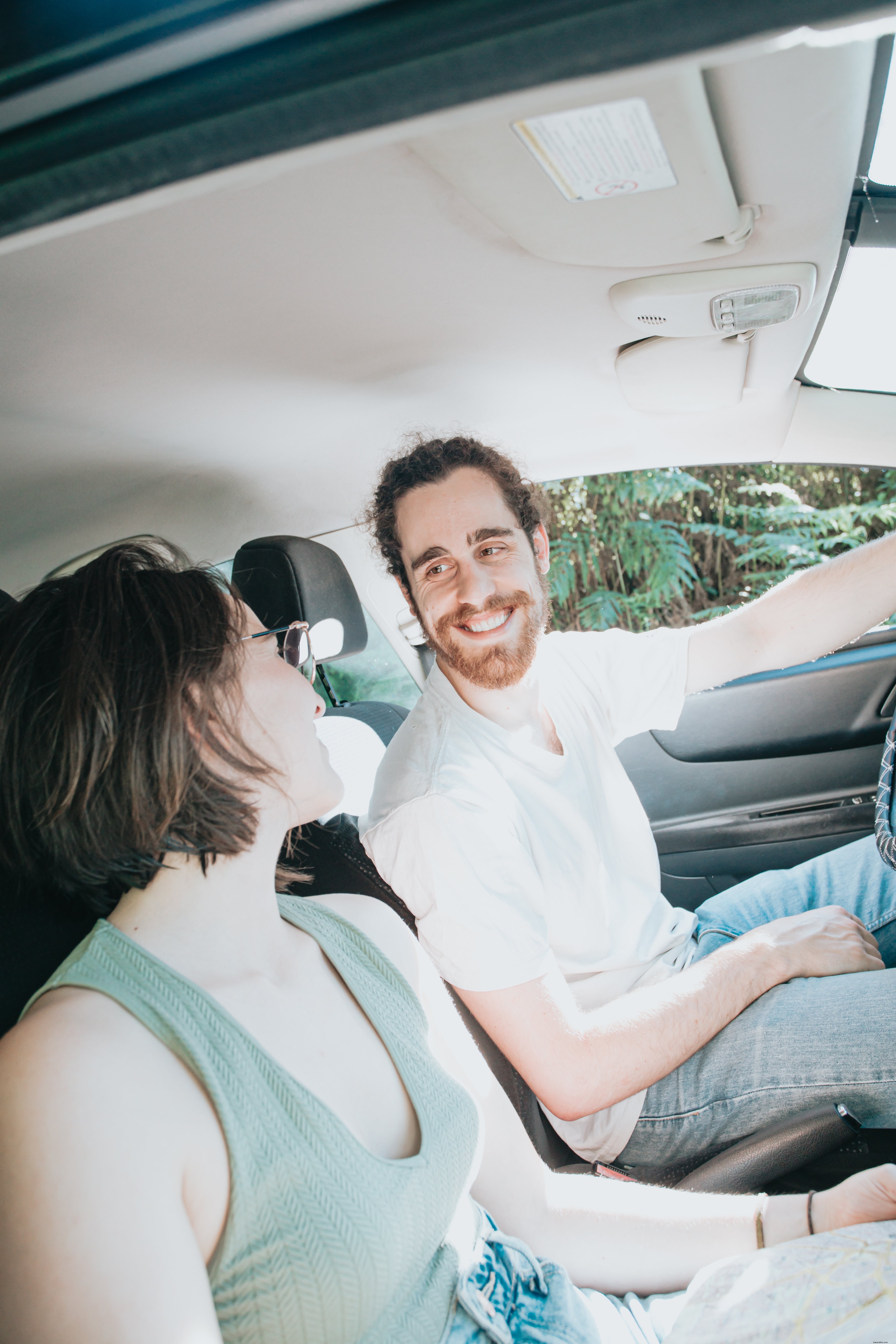 Smiling Travelers Inside a Vehicle: A Heartwarming Group Photo