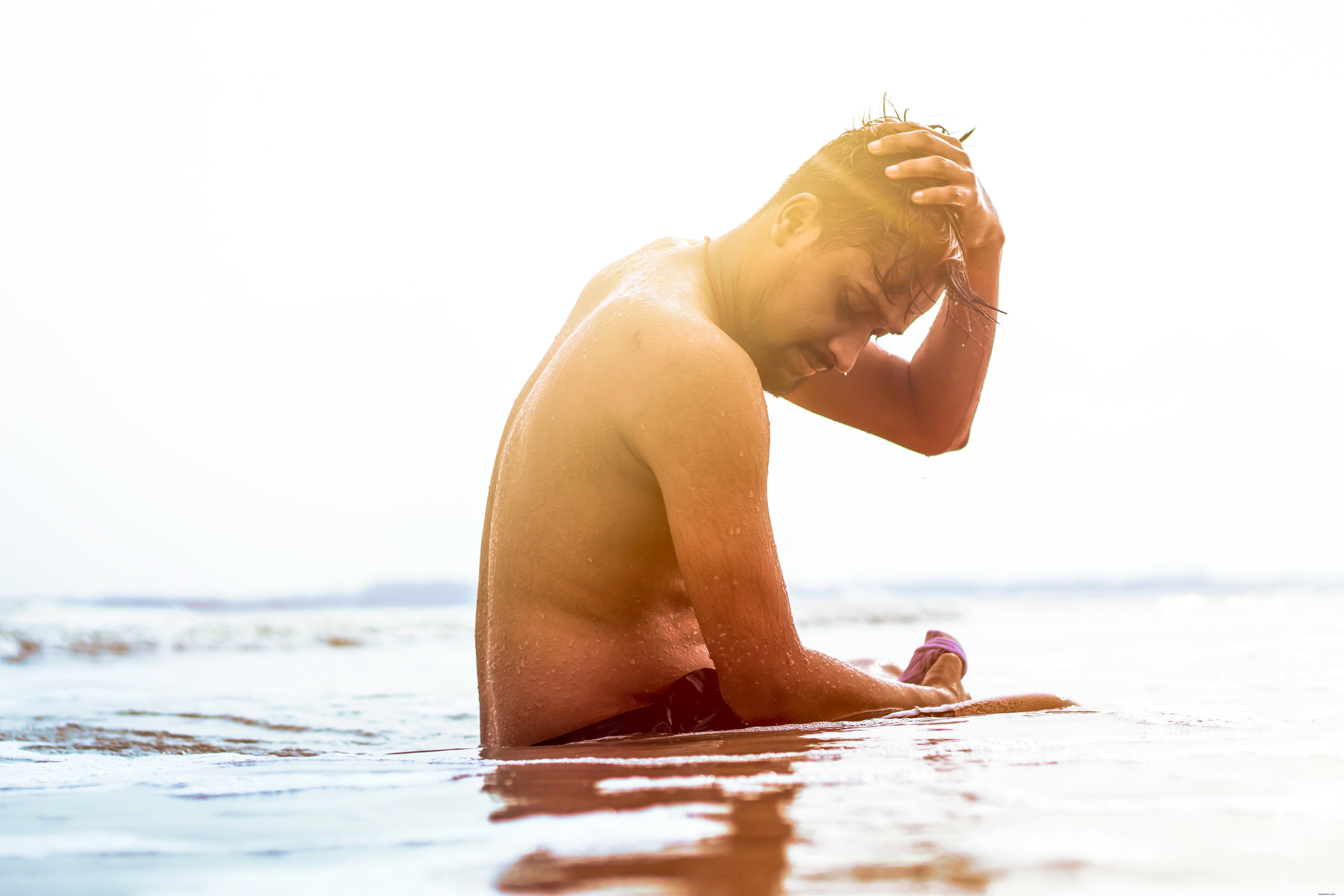 Sunlit Serenity: A Person Enjoying Shallow Water on a Sunny Day