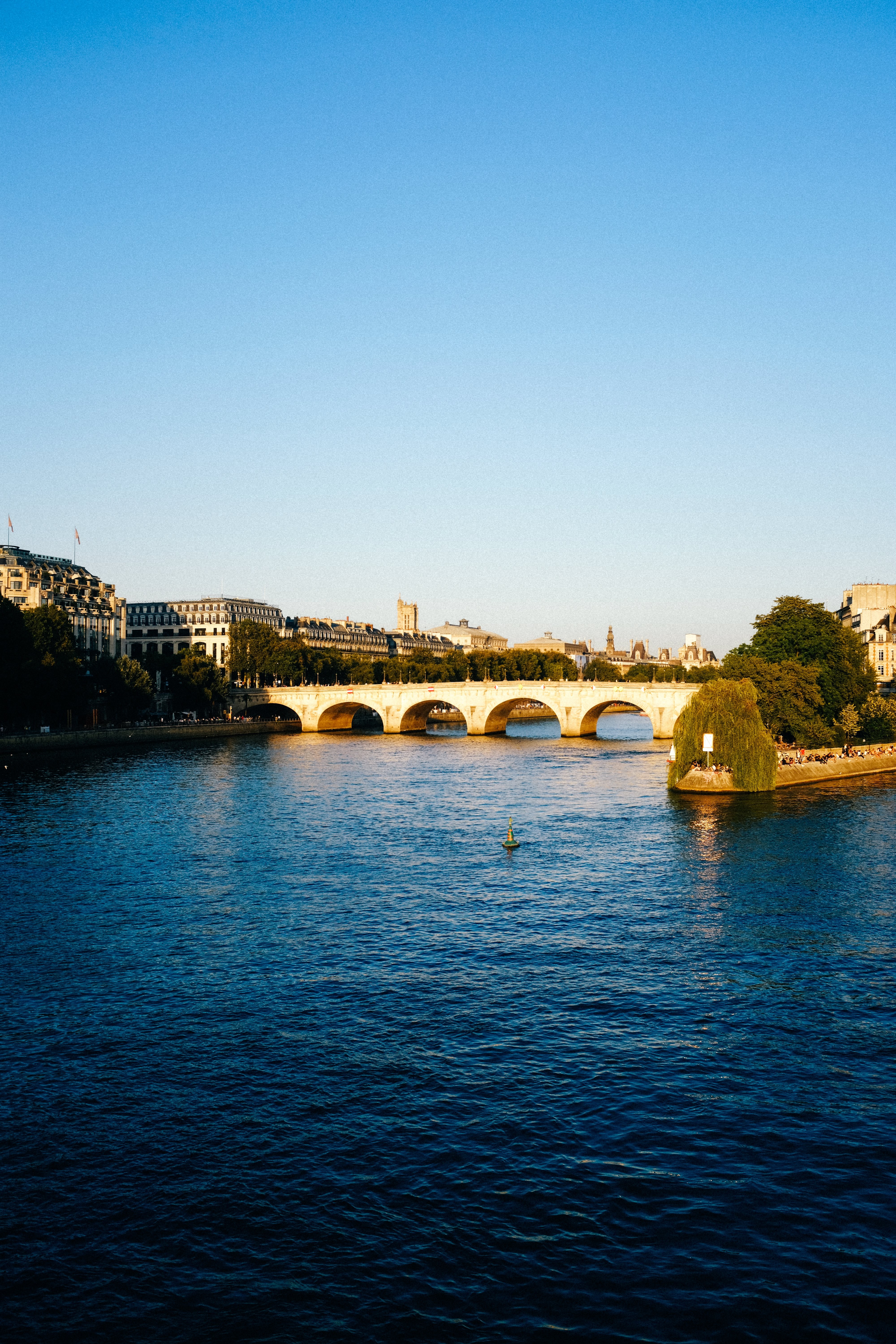 Stunning Cityscape Over Blue Waters: A Bridge Overlook